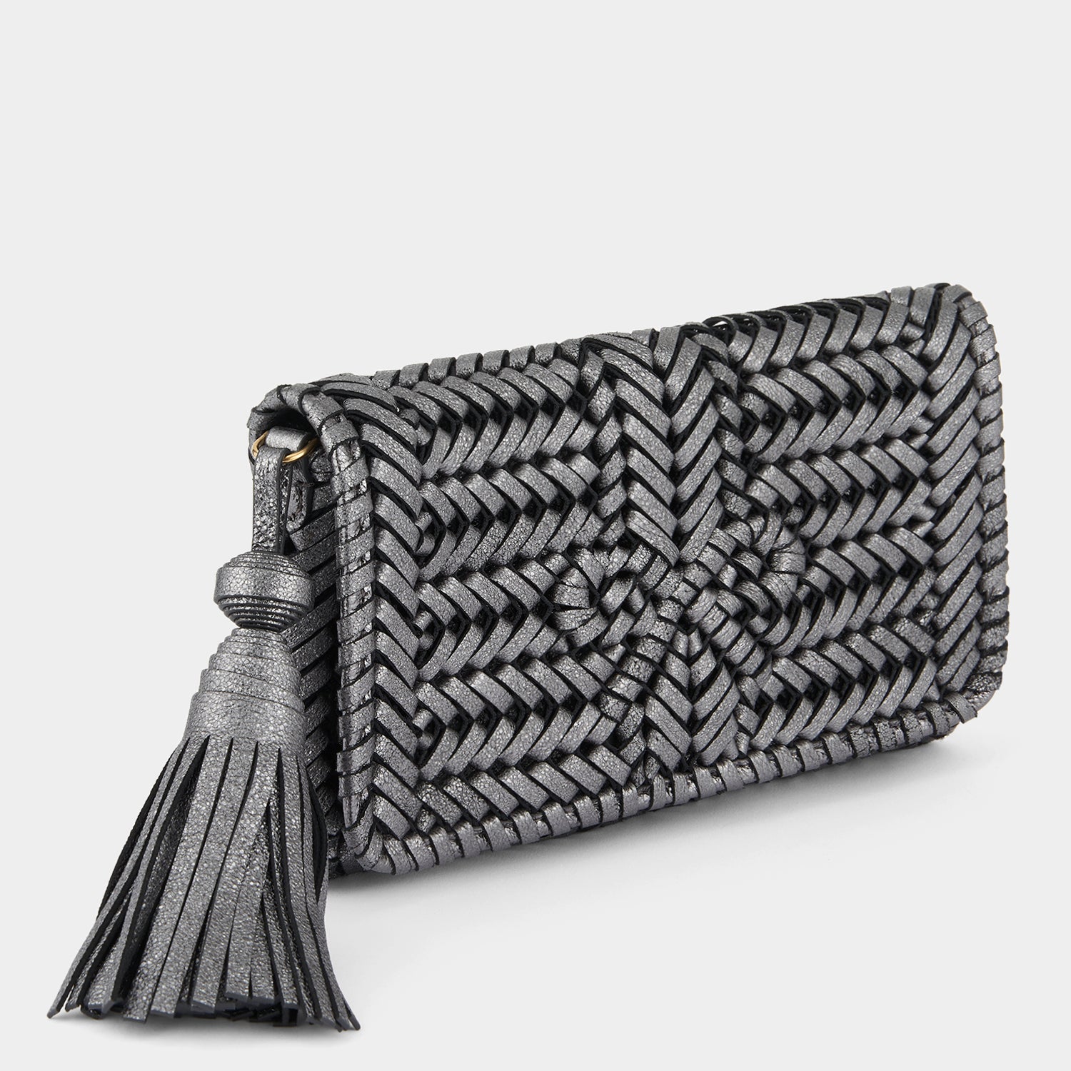 Neeson Tassel Clutch -

                  
                    Metallic Leather in Anthracite -
                  

                  Anya Hindmarch US
