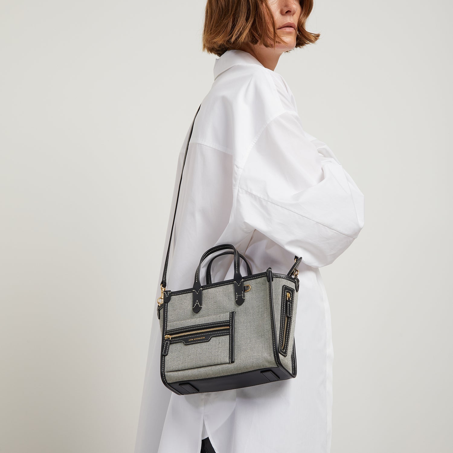 Pocket XS Tote -

                  
                    Mixed Canvas in Salt And Pepper -
                  

                  Anya Hindmarch US

