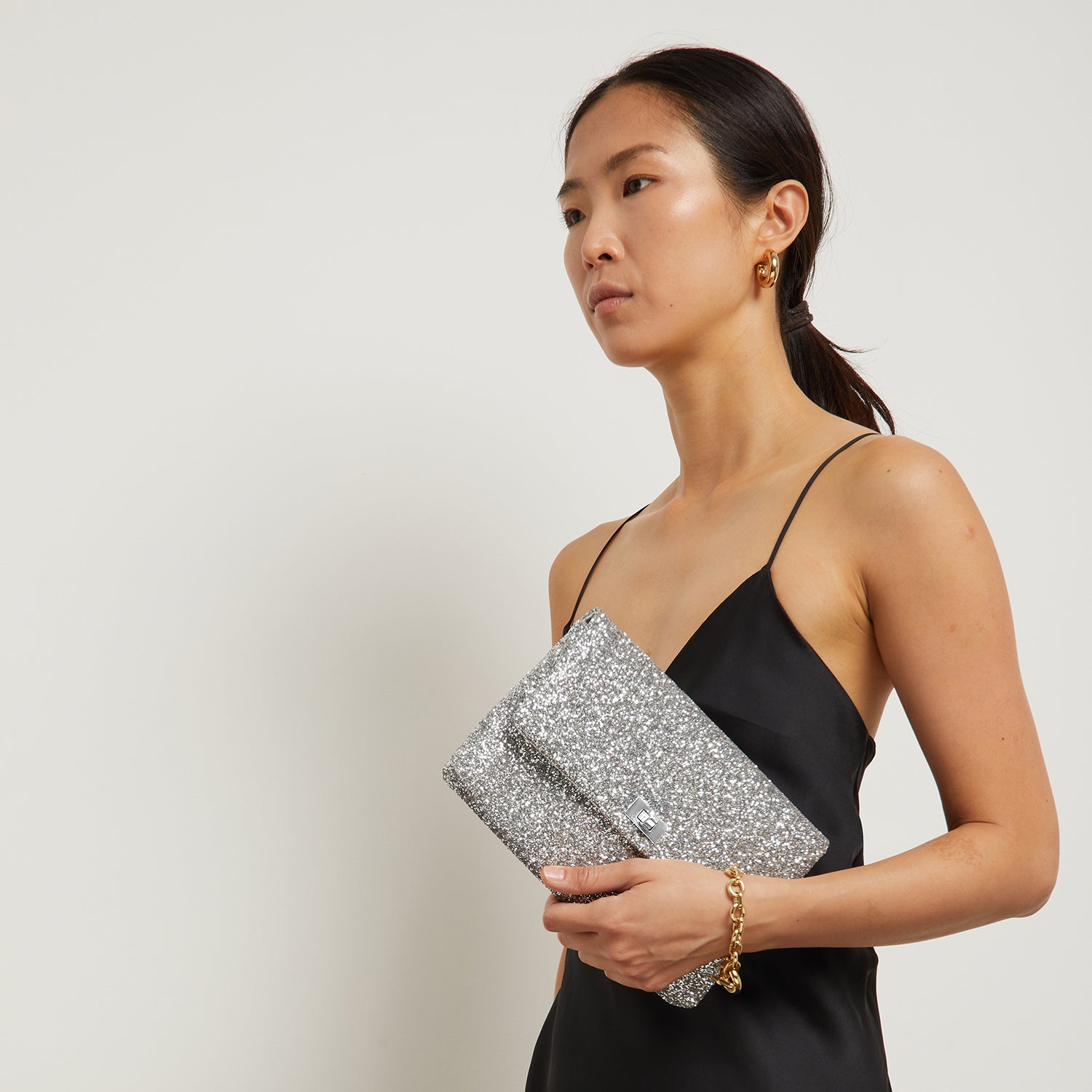 Valorie Clutch -

                  
                    Glitter in Silver -
                  

                  Anya Hindmarch US
