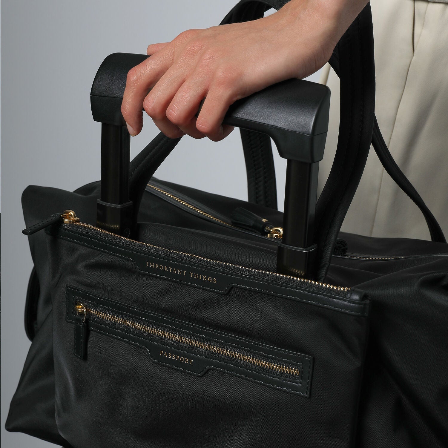 In-Flight Travel Bag -

                  
                    Regenerated Econyl® in Black -
                  

                  Anya Hindmarch US
