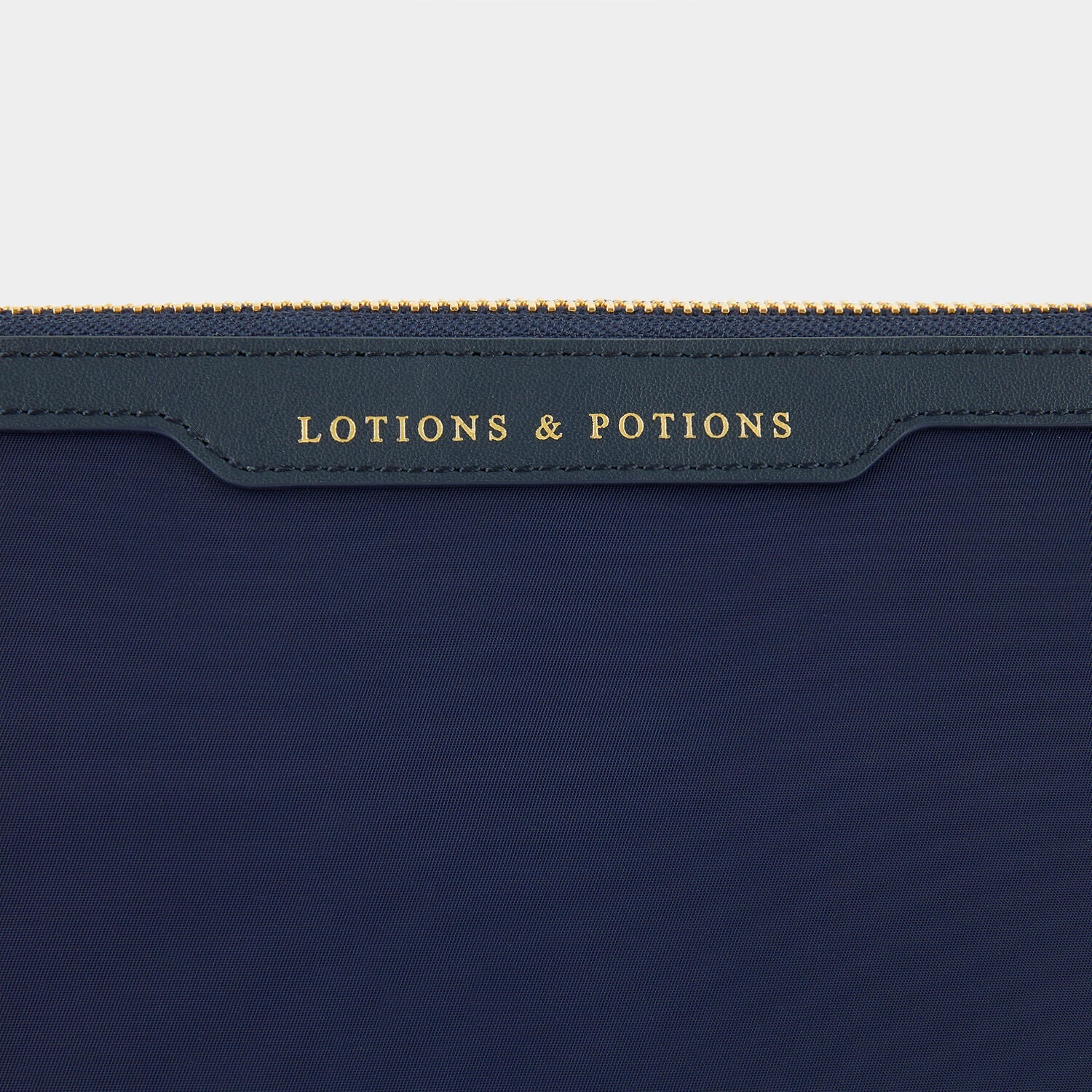 Lotions and Potions Pouch -

                  
                    Econyl® in Dark Marine -
                  

                  Anya Hindmarch US
