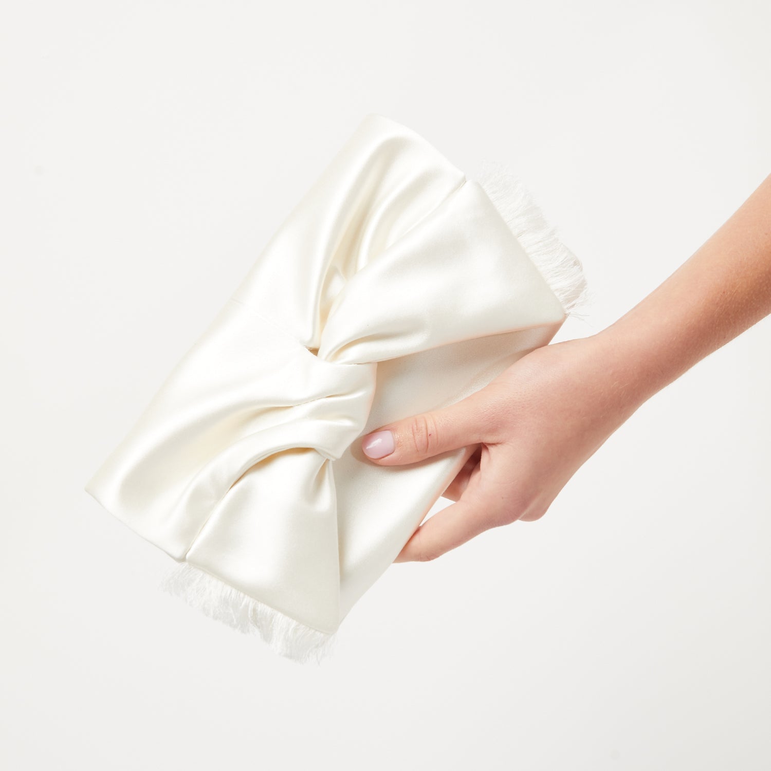 Bow Clutch -

                  
                    Double Satin in Ivory -
                  

                  Anya Hindmarch US
