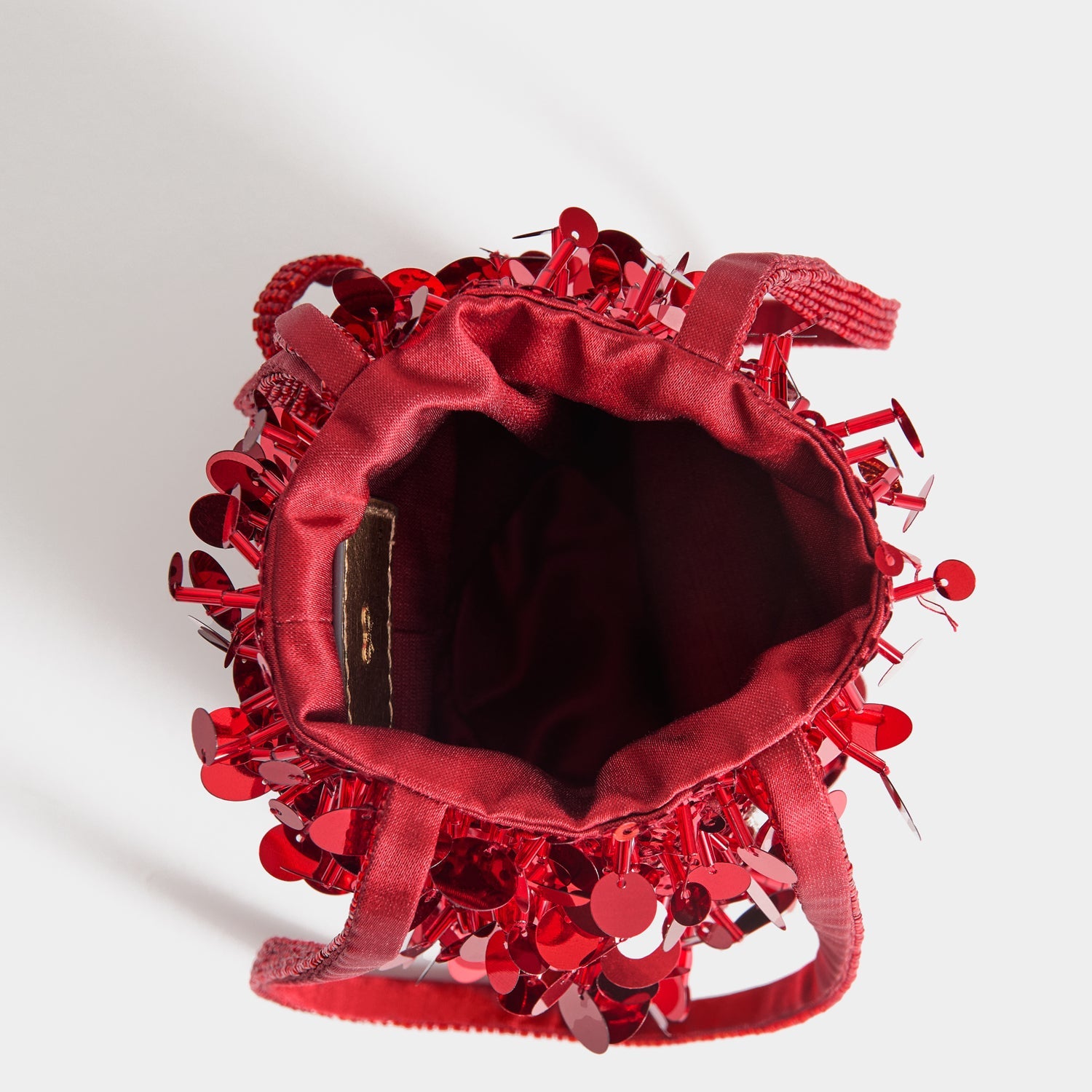 Anya Brands Imperial Leather Mini Bucket Bag -

          
            Satin/Sequins in Red -
          

          Anya Hindmarch US
