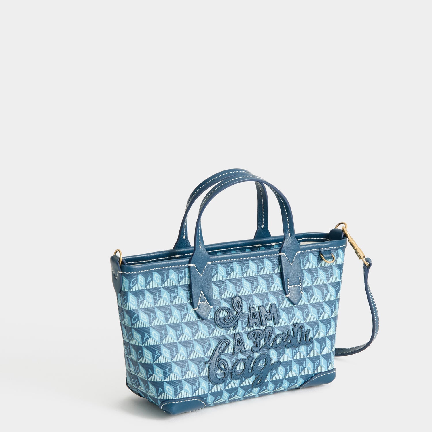 I Am A Plastic Bag Mini Tote -

          
            Recycled canvas/Satin leather in Petrol Blue -
          

          Anya Hindmarch US
