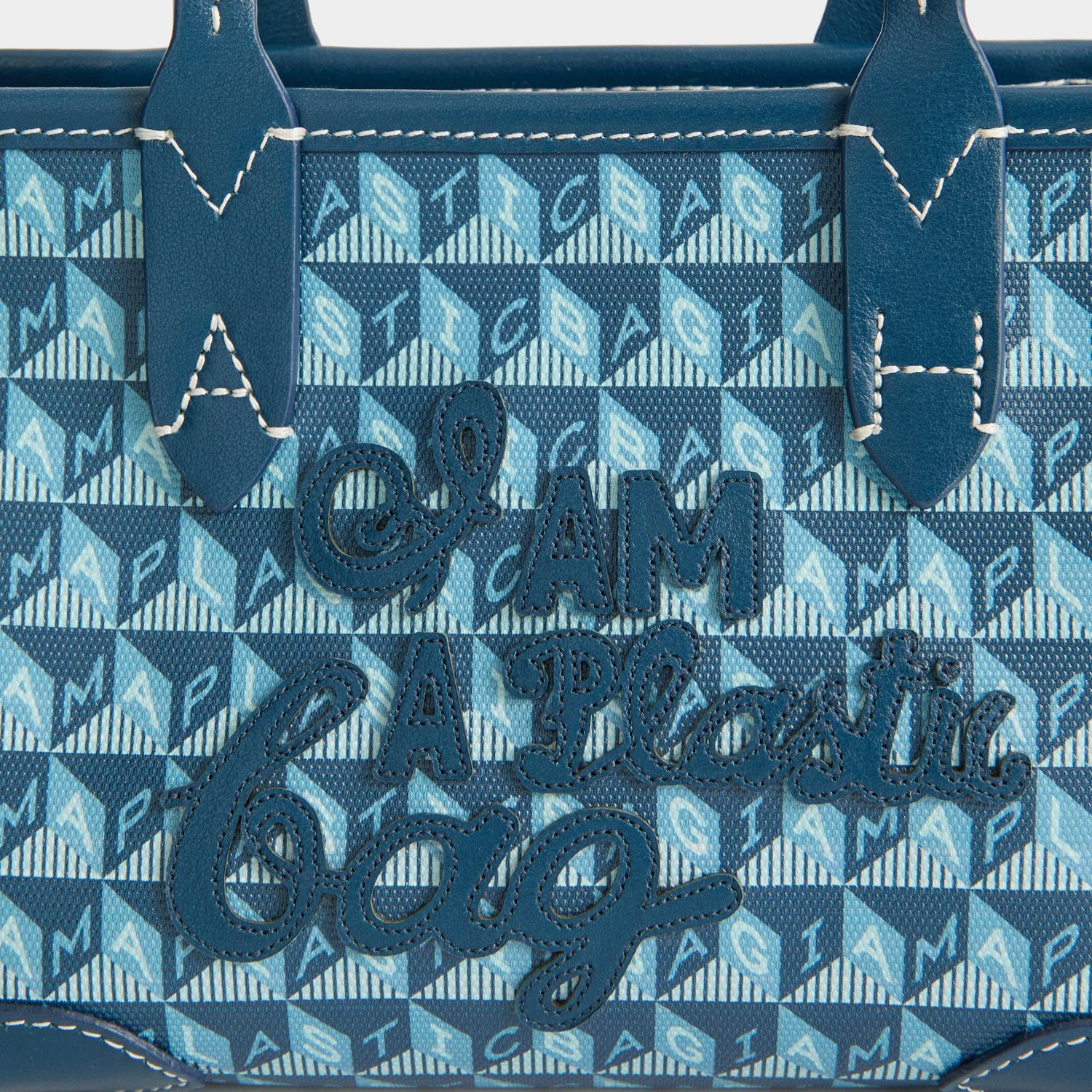 I Am A Plastic Bag Mini Tote -

          
            Recycled canvas/Satin leather in Petrol Blue -
          

          Anya Hindmarch US
