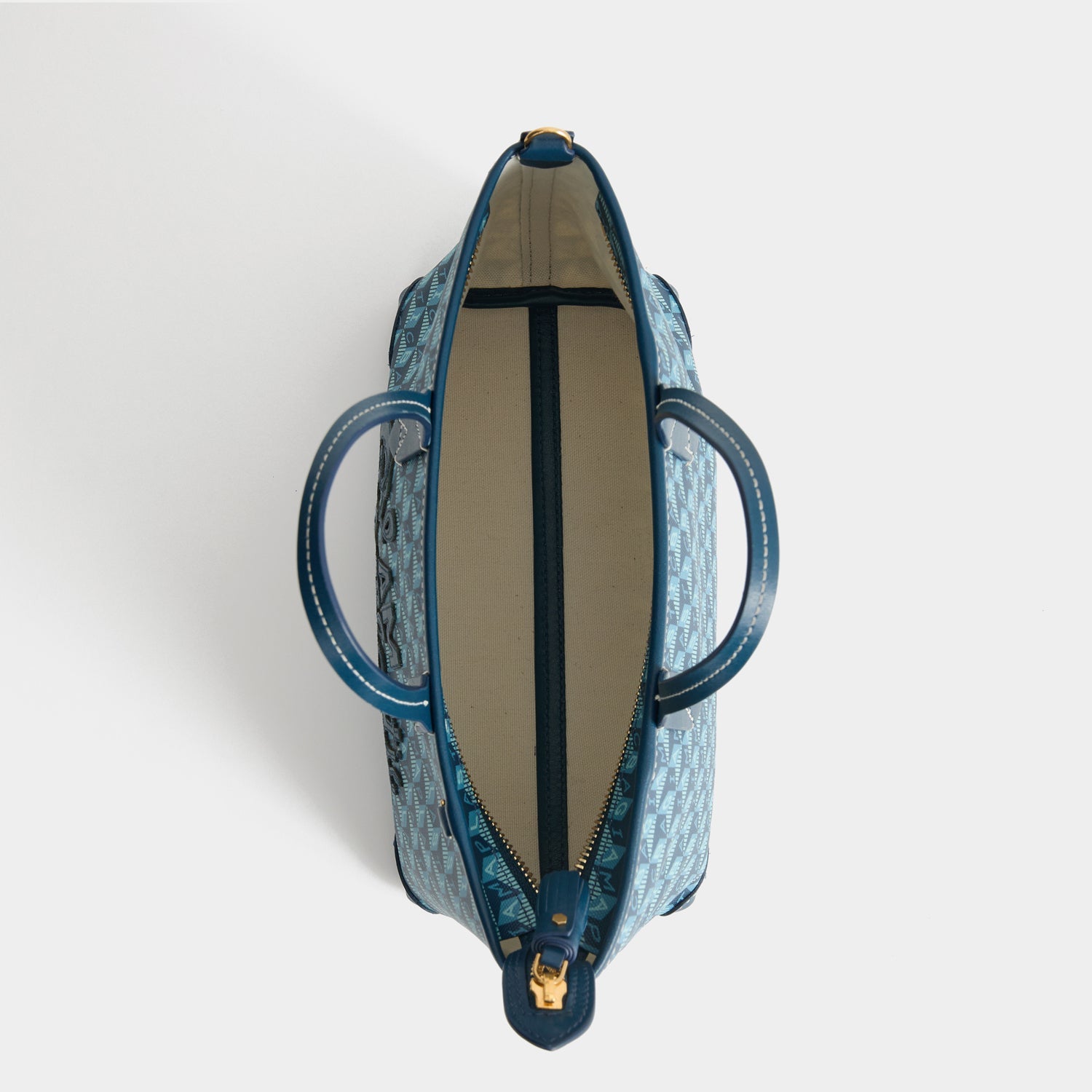 I Am A Plastic Bag Mini Tote -

          
            Recycled canvas/Satin leather in Petrol Blue -
          

          Anya Hindmarch US

