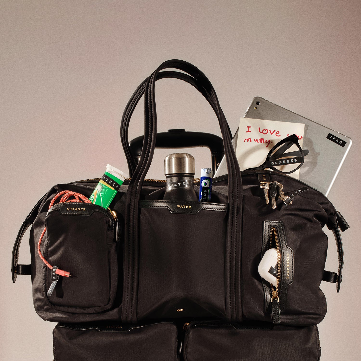 In-Flight Travel Bag -

          
            Regenerated Econyl® in Black -
          

          Anya Hindmarch US
