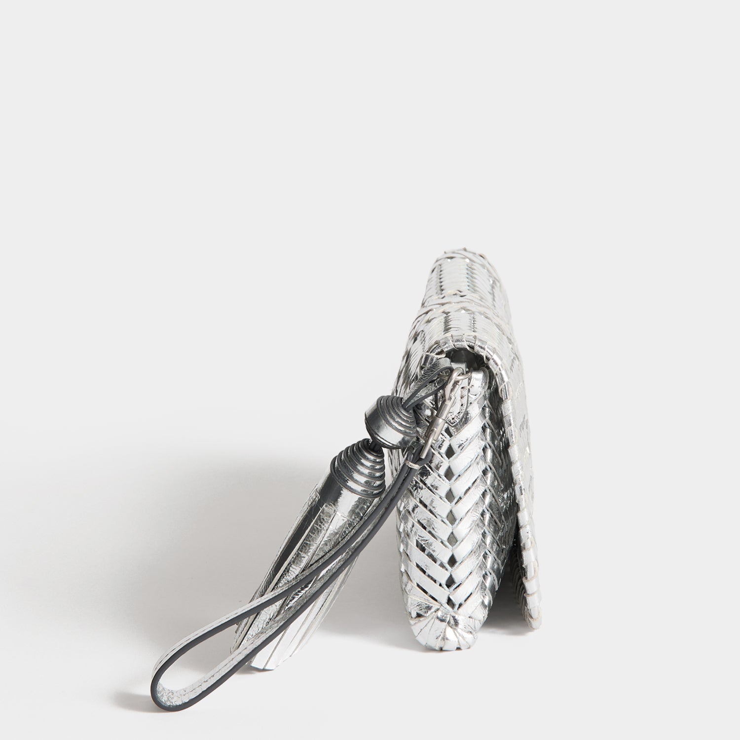 Neeson Tassel Clutch -

          
            Capra Leather in Silver -
          

          Anya Hindmarch US
