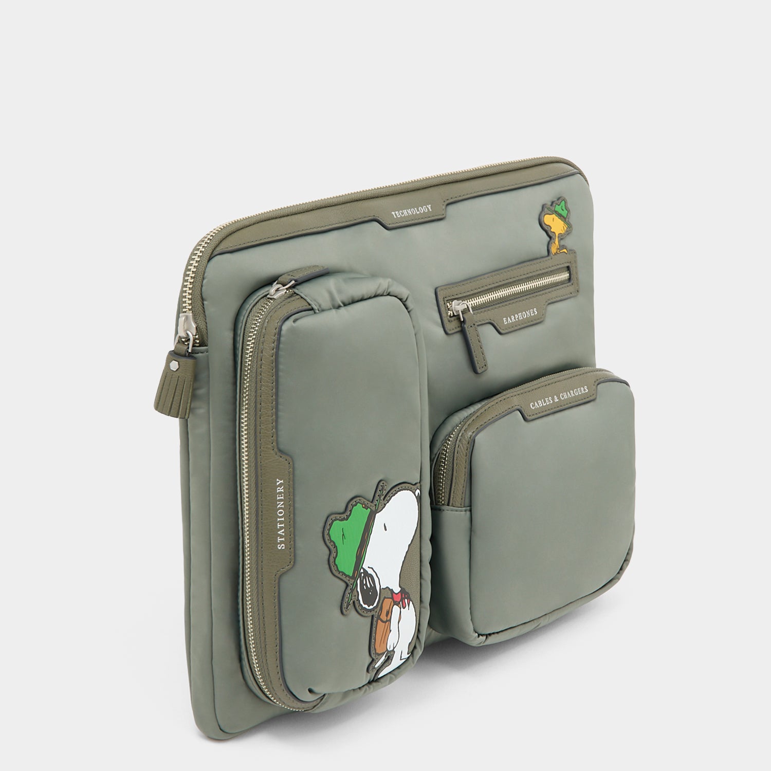 Peanuts Snoopy Tech Case -

          
            Recycled padded fabric in Fern Green -
          

          Anya Hindmarch US
