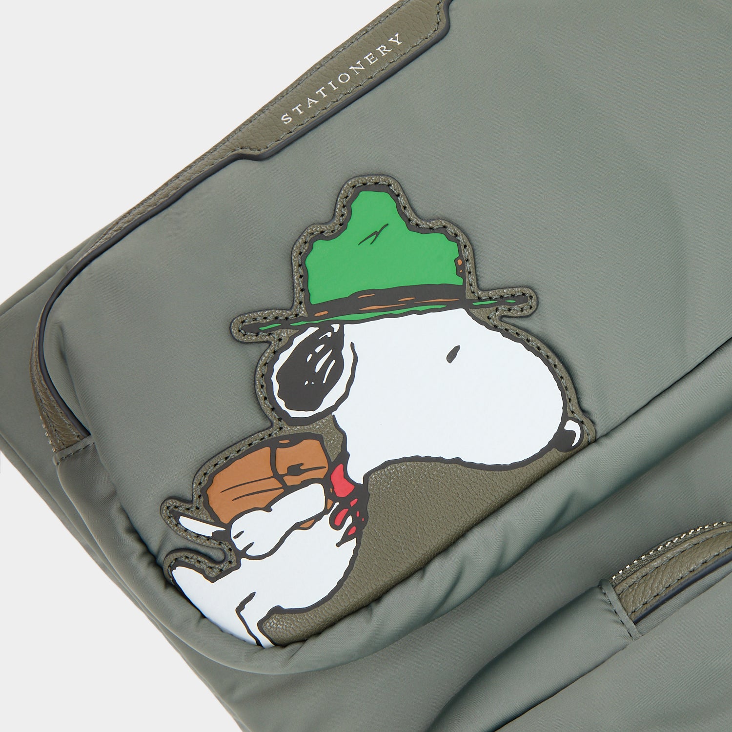 Peanuts Snoopy Tech Case -

          
            Recycled padded fabric in Fern Green -
          

          Anya Hindmarch US
