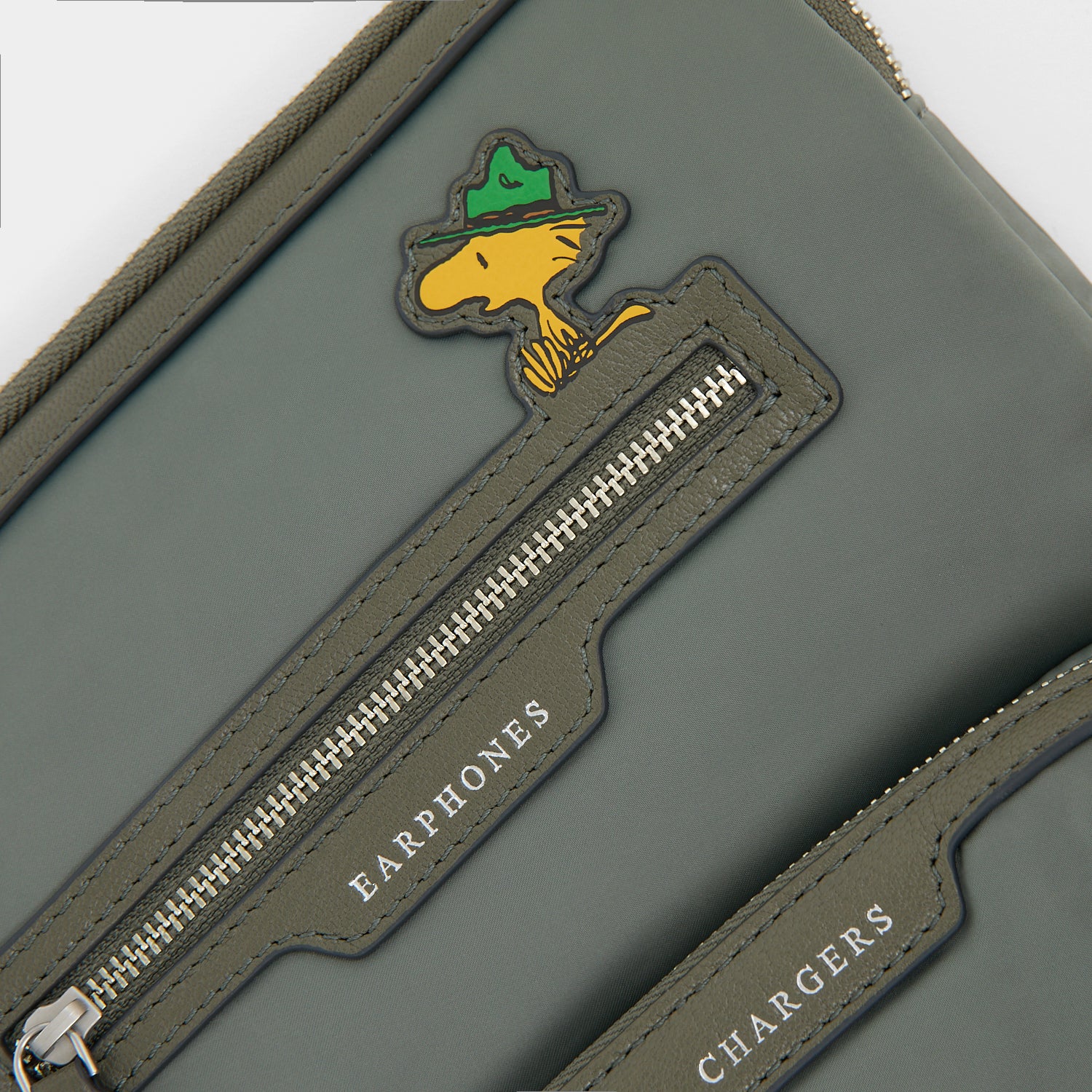 Peanuts Snoopy Tech Case -

          
            Recycled padded fabric in Fern Green -
          

          Anya Hindmarch US
