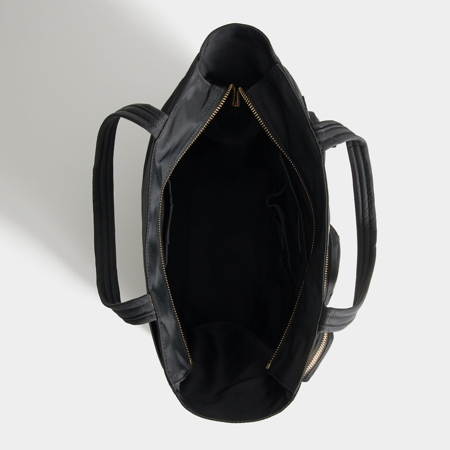 Commuter Tote -

          
            Regenerated Econyl® in Black -
          

          Anya Hindmarch US
