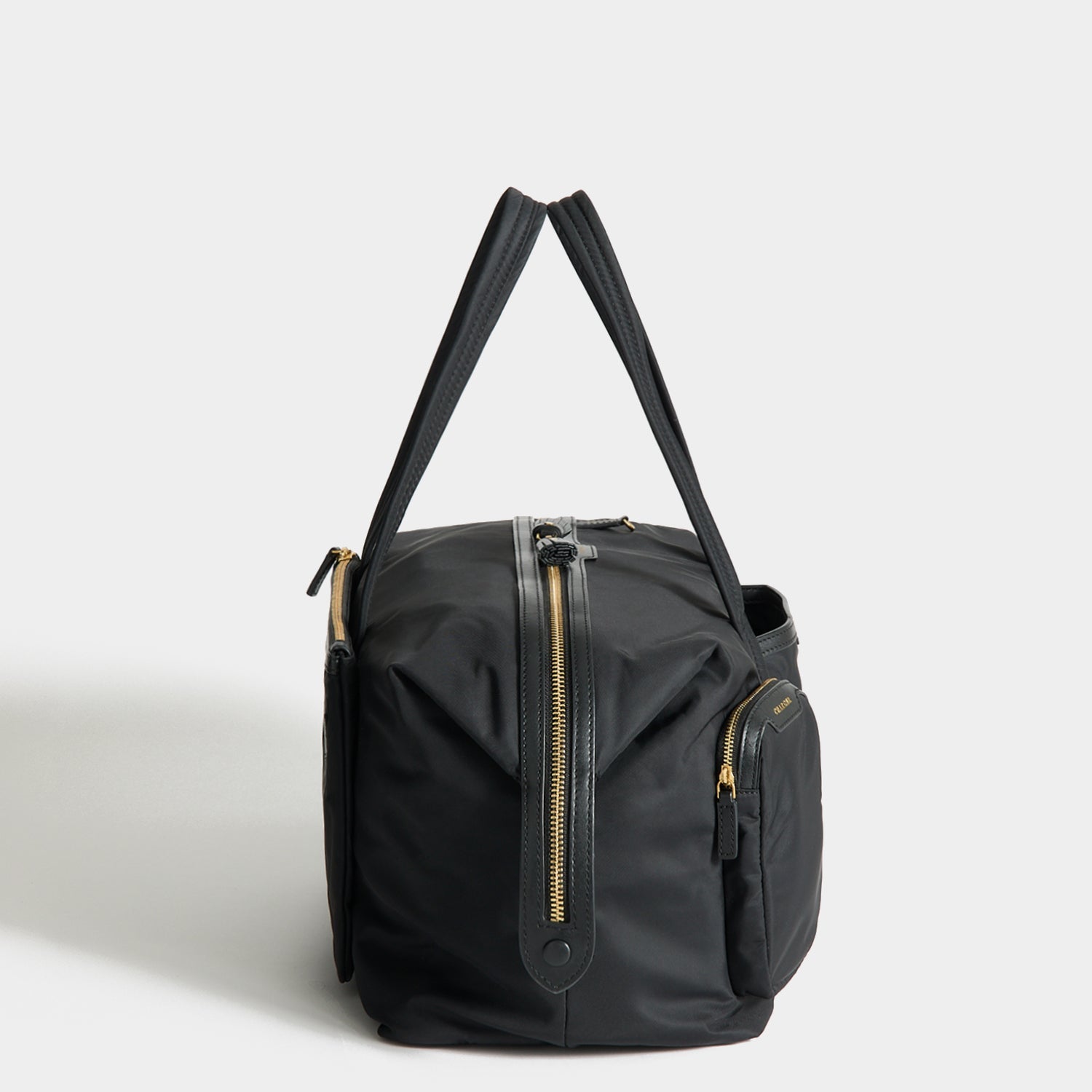 In-Flight Travel Bag -

          
            Regenerated Econyl® in Black -
          

          Anya Hindmarch US
