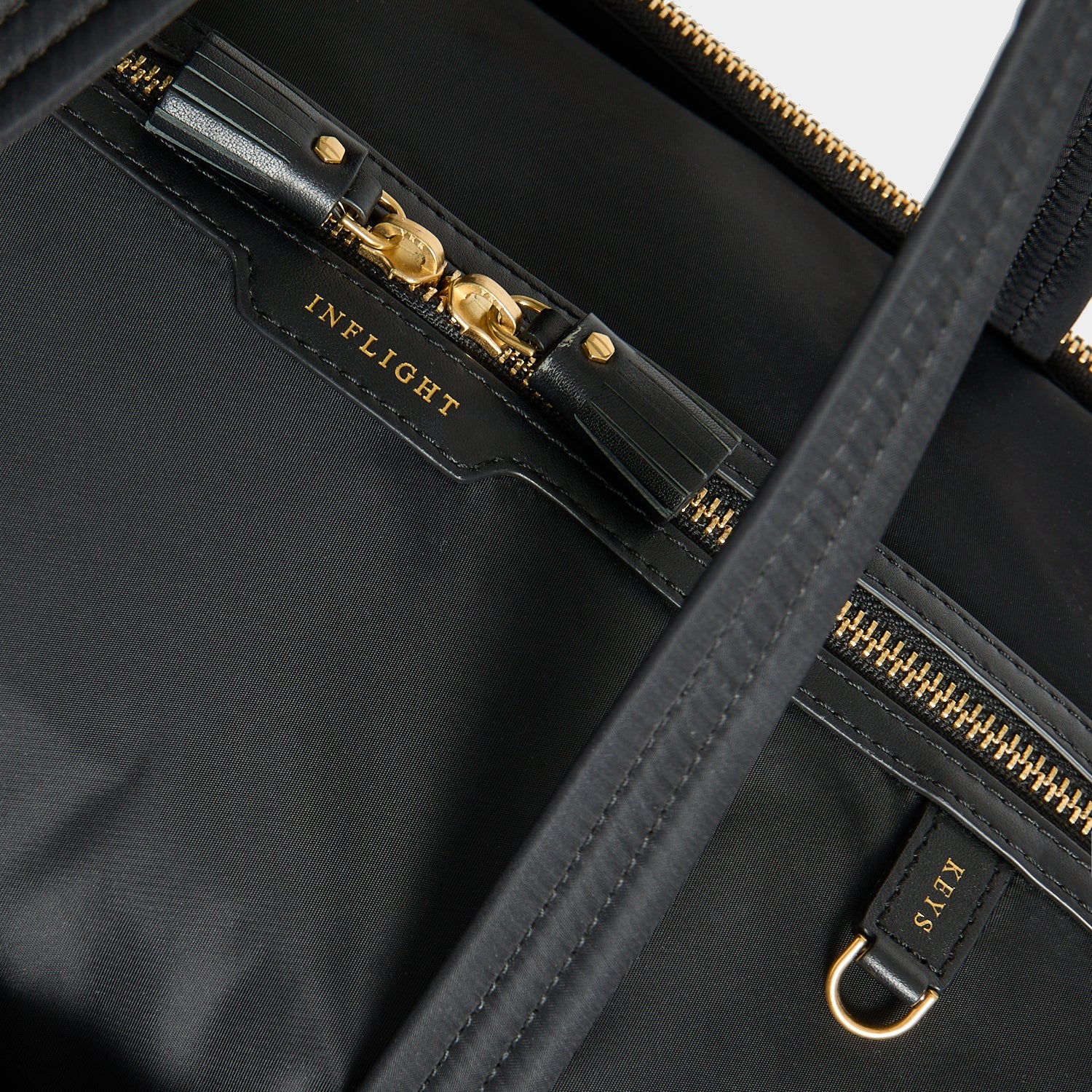 In-Flight Travel Bag -

          
            Regenerated Econyl® in Black -
          

          Anya Hindmarch US
