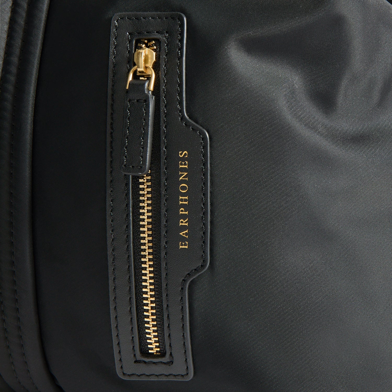 In-Flight Travel Bag -

          
            Regenerated Econyl® in Black -
          

          Anya Hindmarch US
