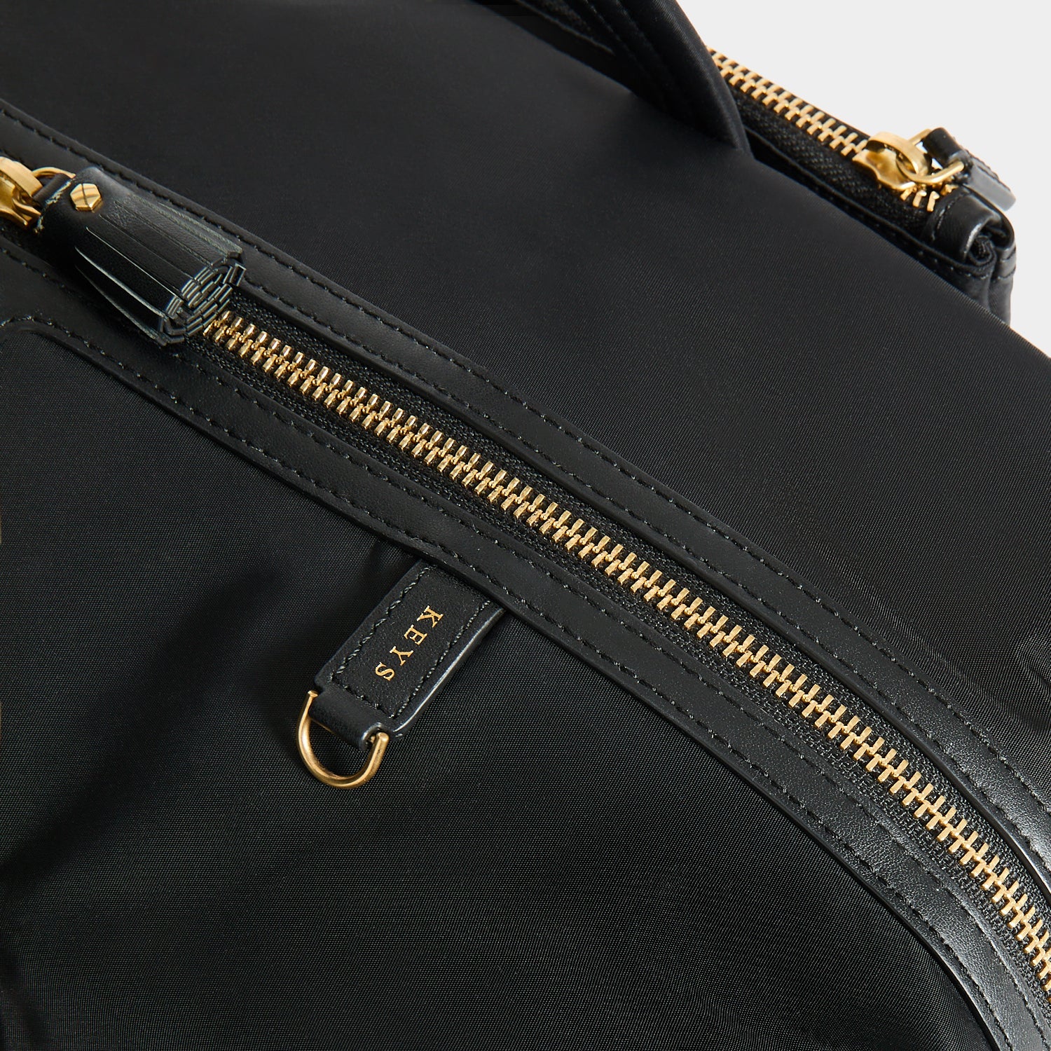 In-Flight Travel Bag -

          
            Regenerated Econyl® in Black -
          

          Anya Hindmarch US

