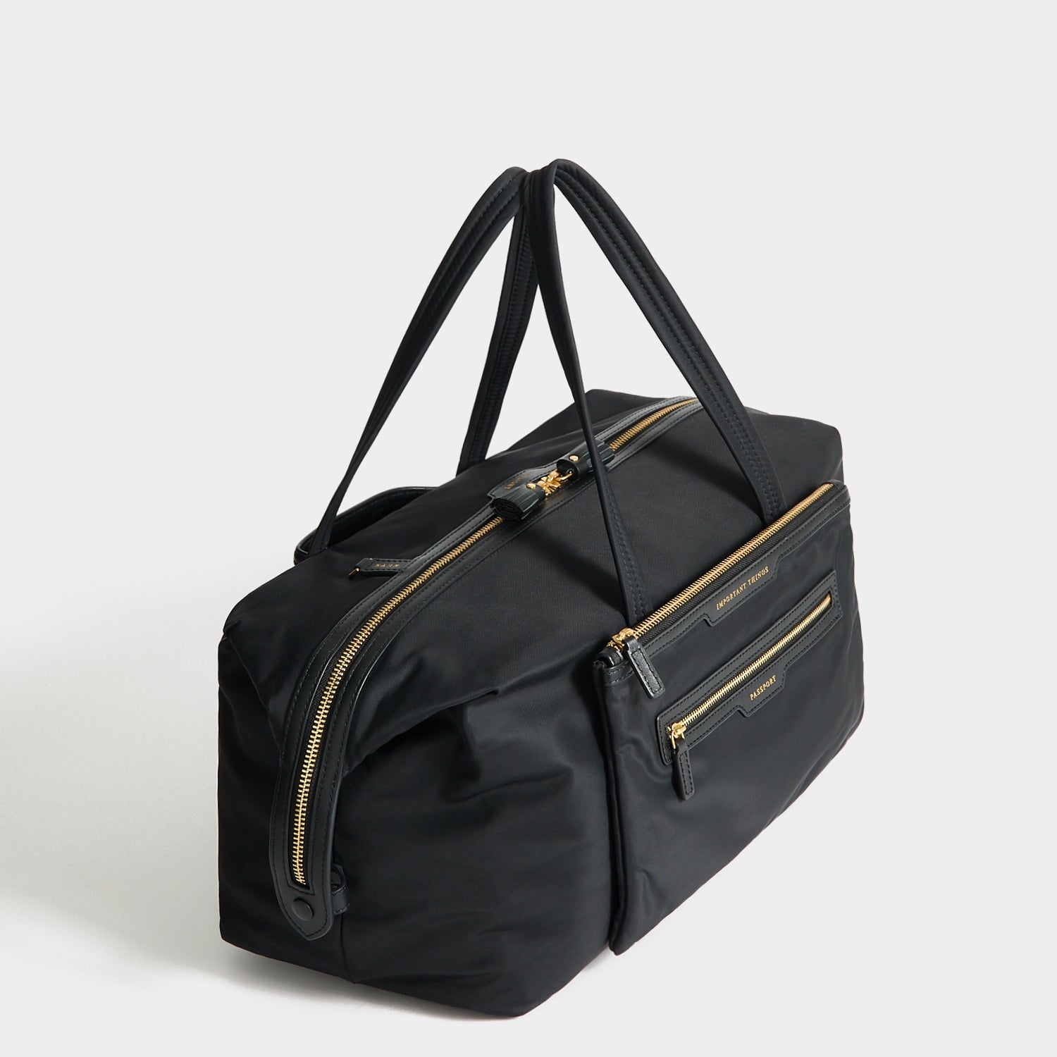 In-Flight Travel Bag -

          
            Regenerated Econyl® in Black -
          

          Anya Hindmarch US
