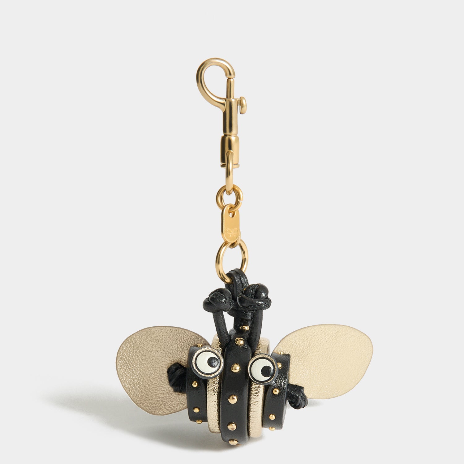 Bee Charm -

          
            Capra Leather in black -
          

          Anya Hindmarch US
