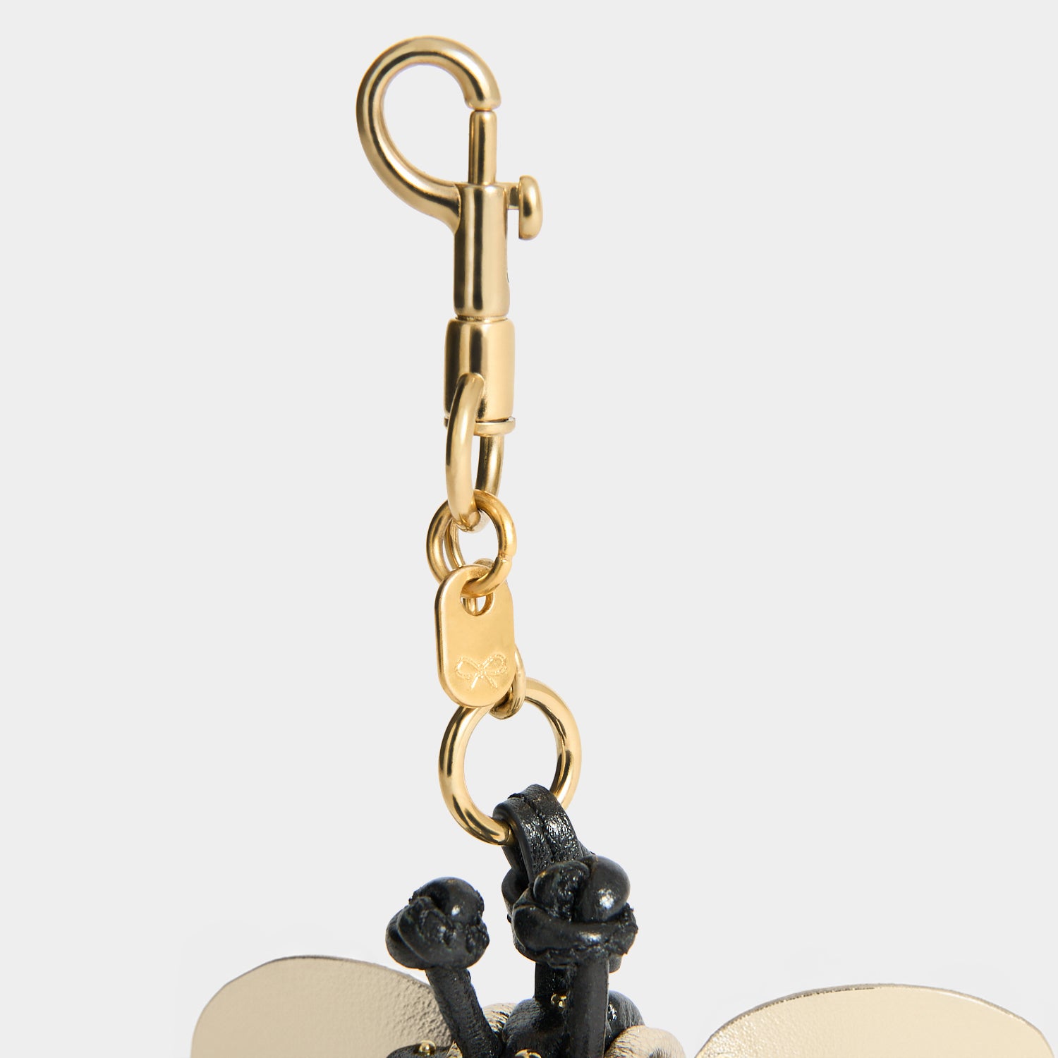Bee Charm -

          
            Capra Leather in black -
          

          Anya Hindmarch US
