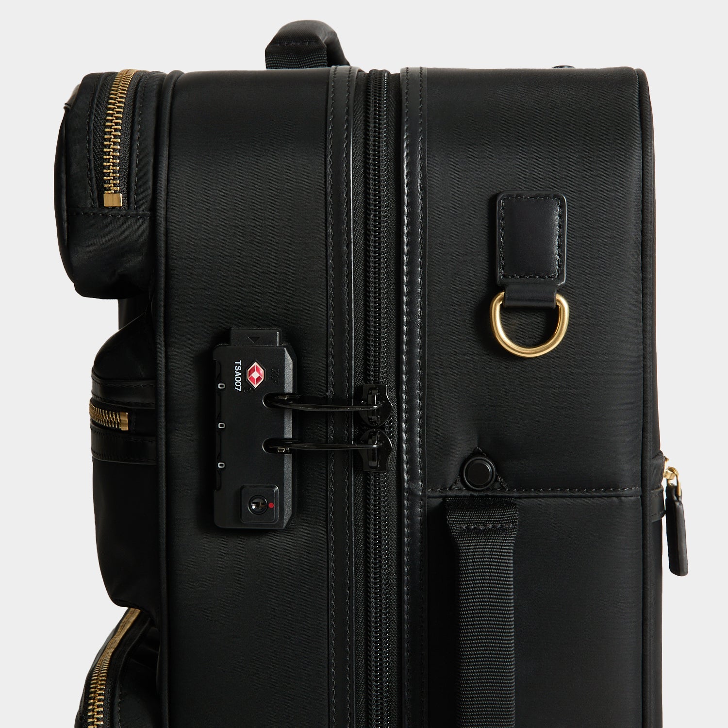 Short-Haul Suitcase -

          
            Econyl® Regenerated Nylon in Black -
          

          Anya Hindmarch US
