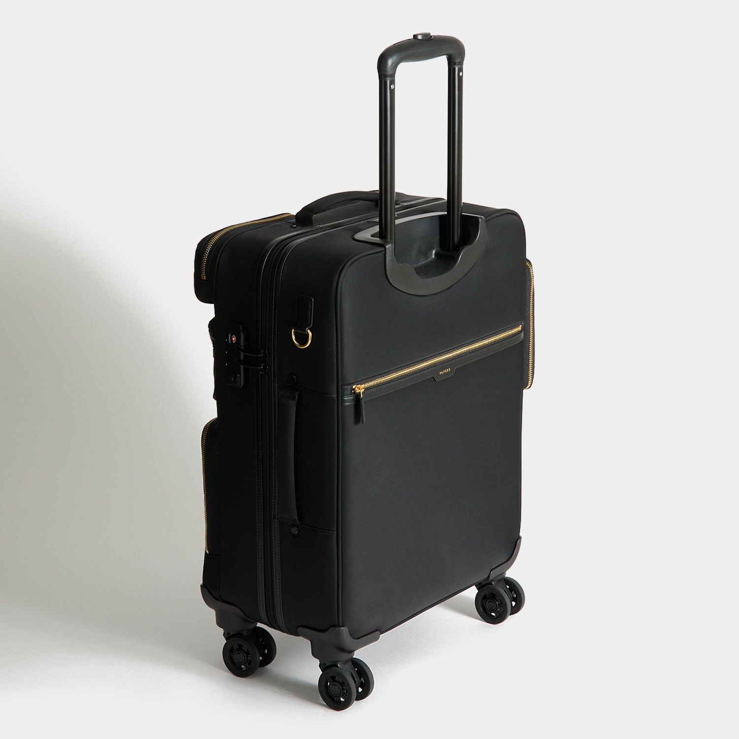 Short-Haul Suitcase -

          
            Econyl® Regenerated Nylon in Black -
          

          Anya Hindmarch US
