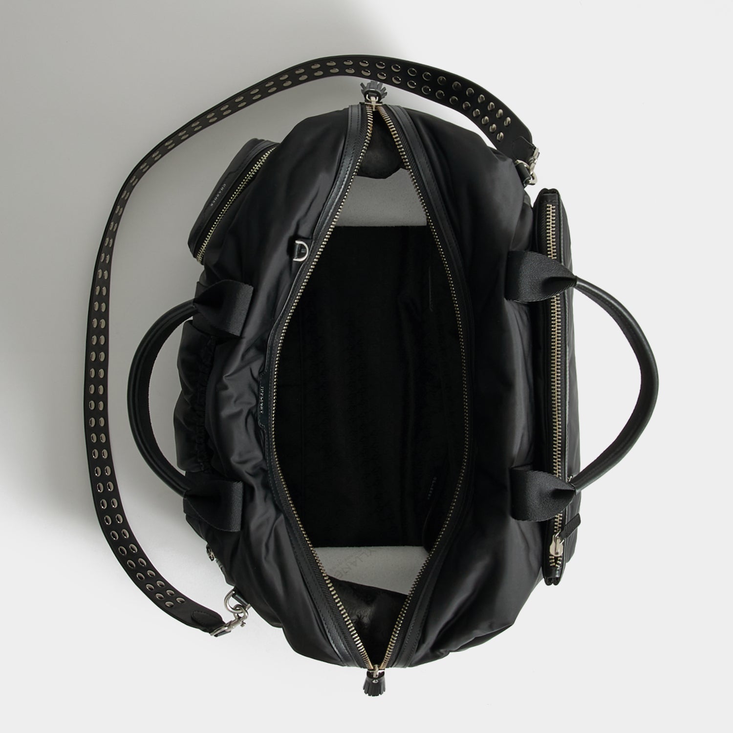 Studs In-Flight Maxi Travel Bag -

          
            Recycled Satin/Calf Leather in Black -
          

          Anya Hindmarch US
