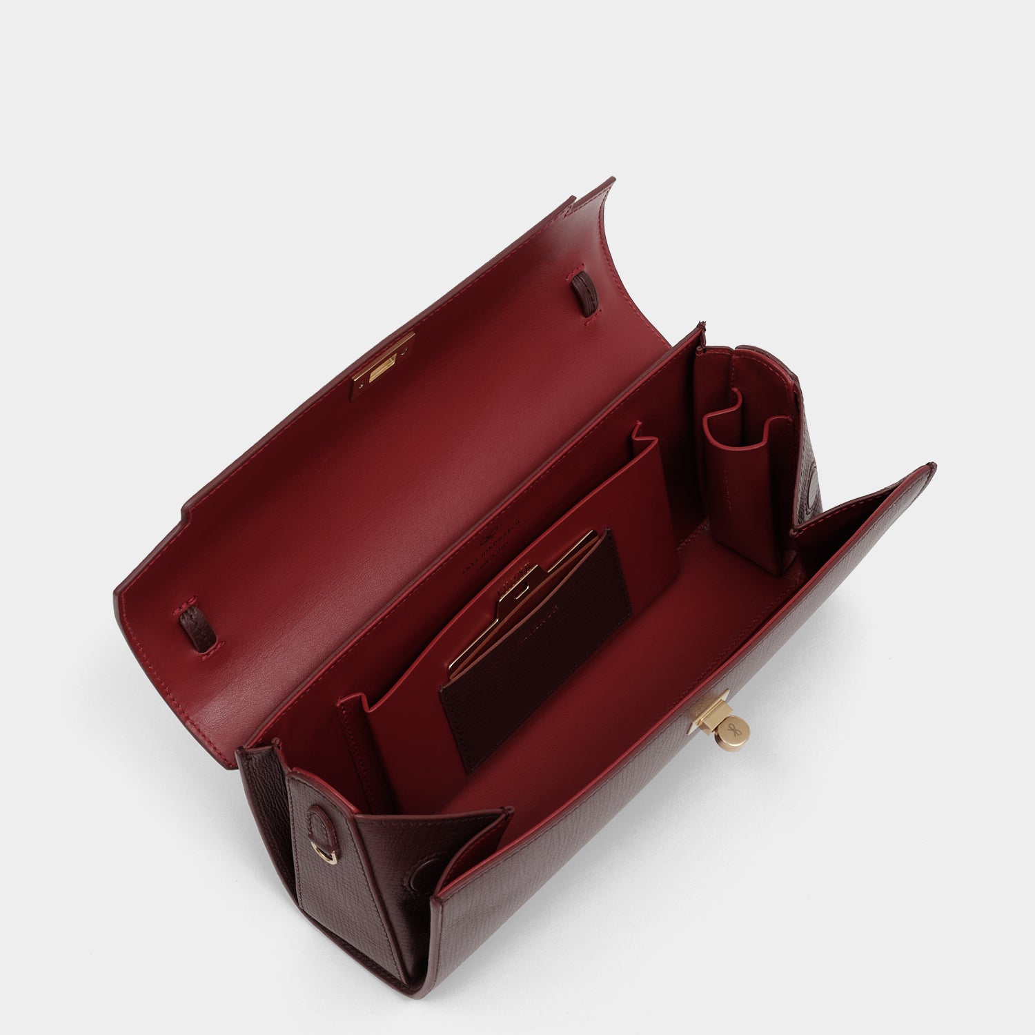 Mortimer Clutch -

          
            Crosshatch Leather in Barolo Red  -
          

          Anya Hindmarch US
