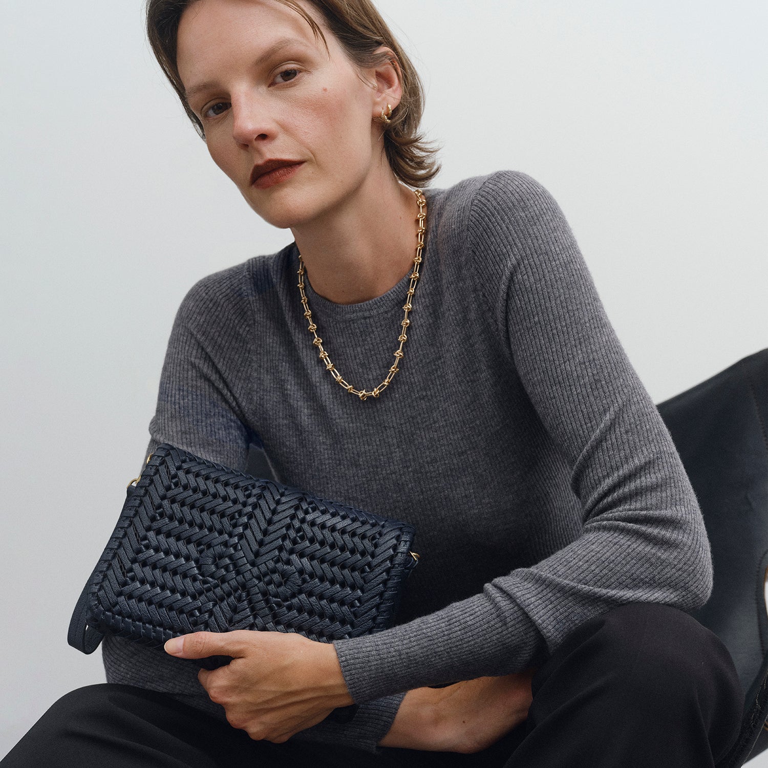 Neeson Cross-body -

          
            Capra Leather in Marine -
          

          Anya Hindmarch US
