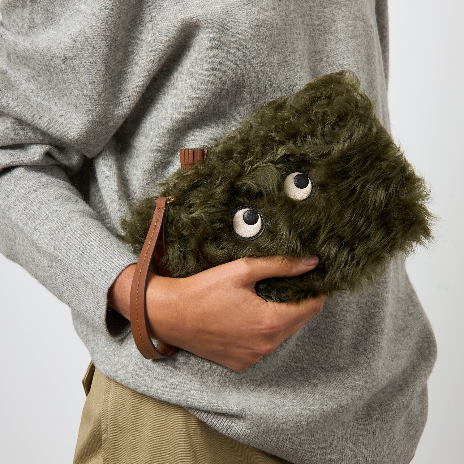 Shearling Eyes Clutch -

          
            Shearling/Smooth Leather in Khaki Green -
          

          Anya Hindmarch US
