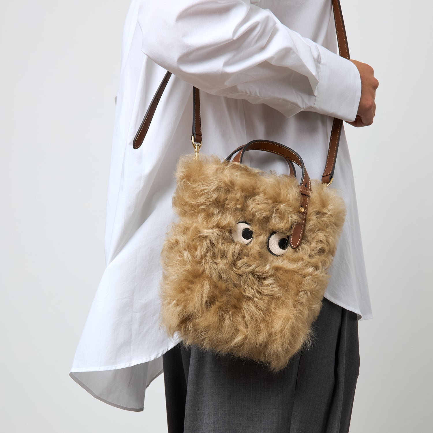 N/S Mini Eyes Shearling Tote -

          
            Shearling/Smooth Leather in Taupe -
          

          Anya Hindmarch US
