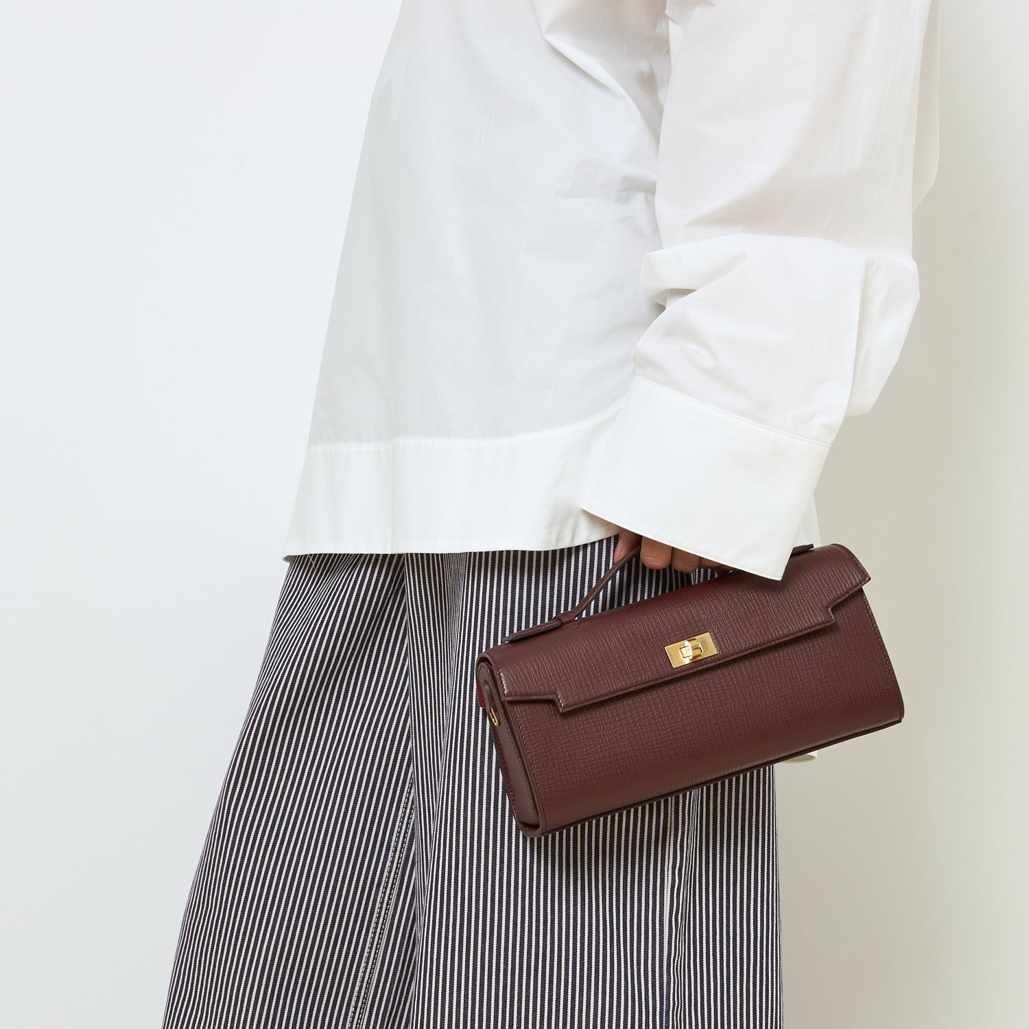 Mortimer Clutch -

          
            Crosshatch Leather in Barolo Red  -
          

          Anya Hindmarch US
