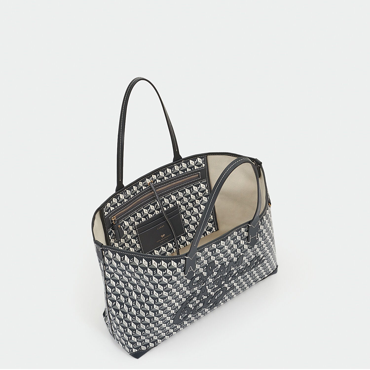 I Am A Plastic Bag Small Motif Tote -

          
            Recycled Coated Canvas in Charcoal -
          

          Anya Hindmarch US
