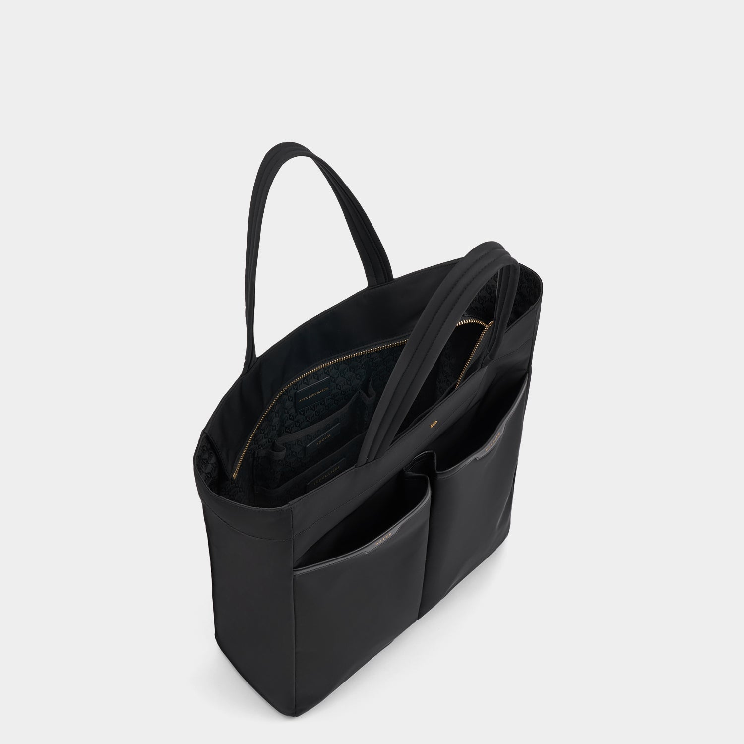 Nevis Tote -

          
            Regenerated ECONYL® in Black -
          

          Anya Hindmarch US
