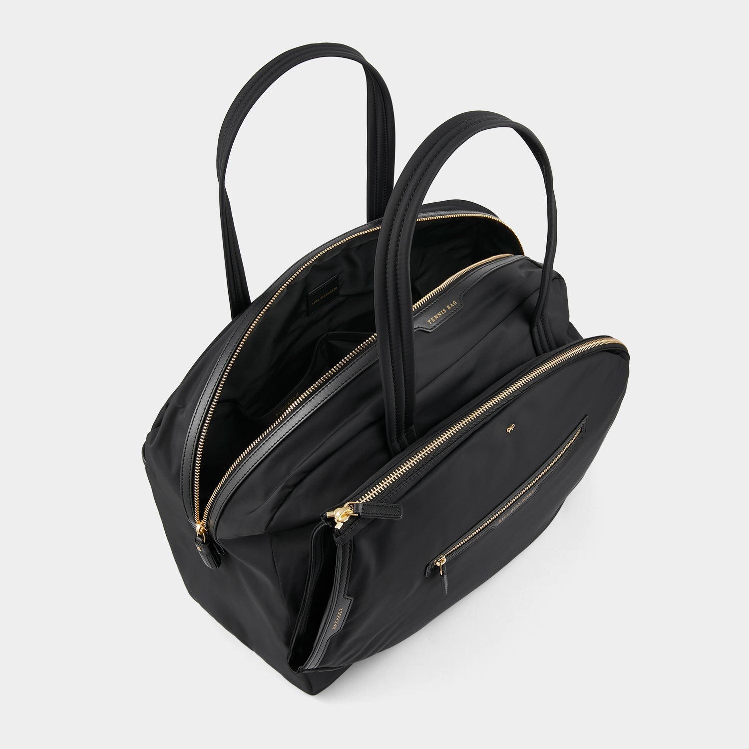 Tennis Bag -

          
            Econyl® Regenerated Nylon in Black -
          

          Anya Hindmarch US
