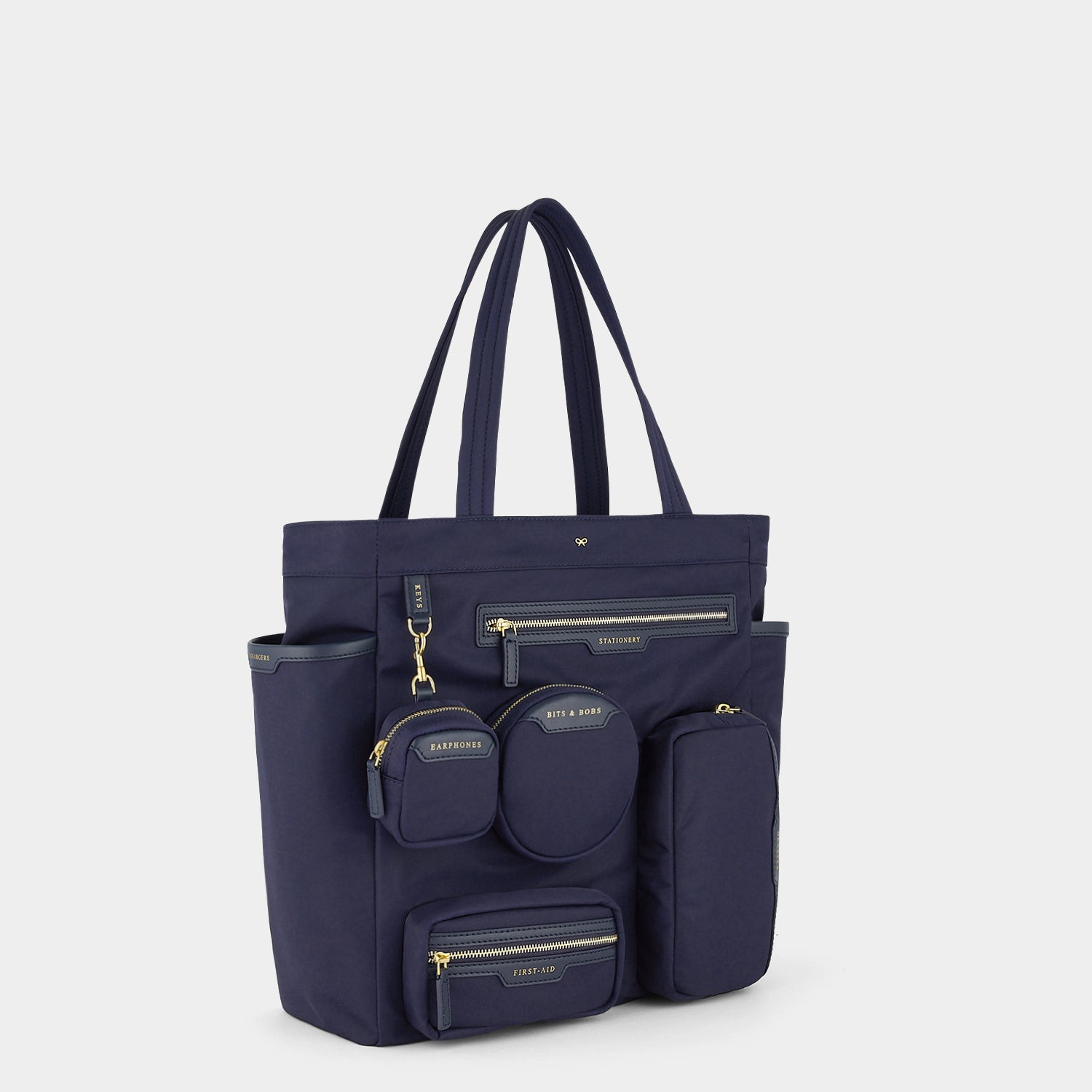 Commuter Tote -

          
            Regenerated Econyl® in Marine -
          

          Anya Hindmarch US
