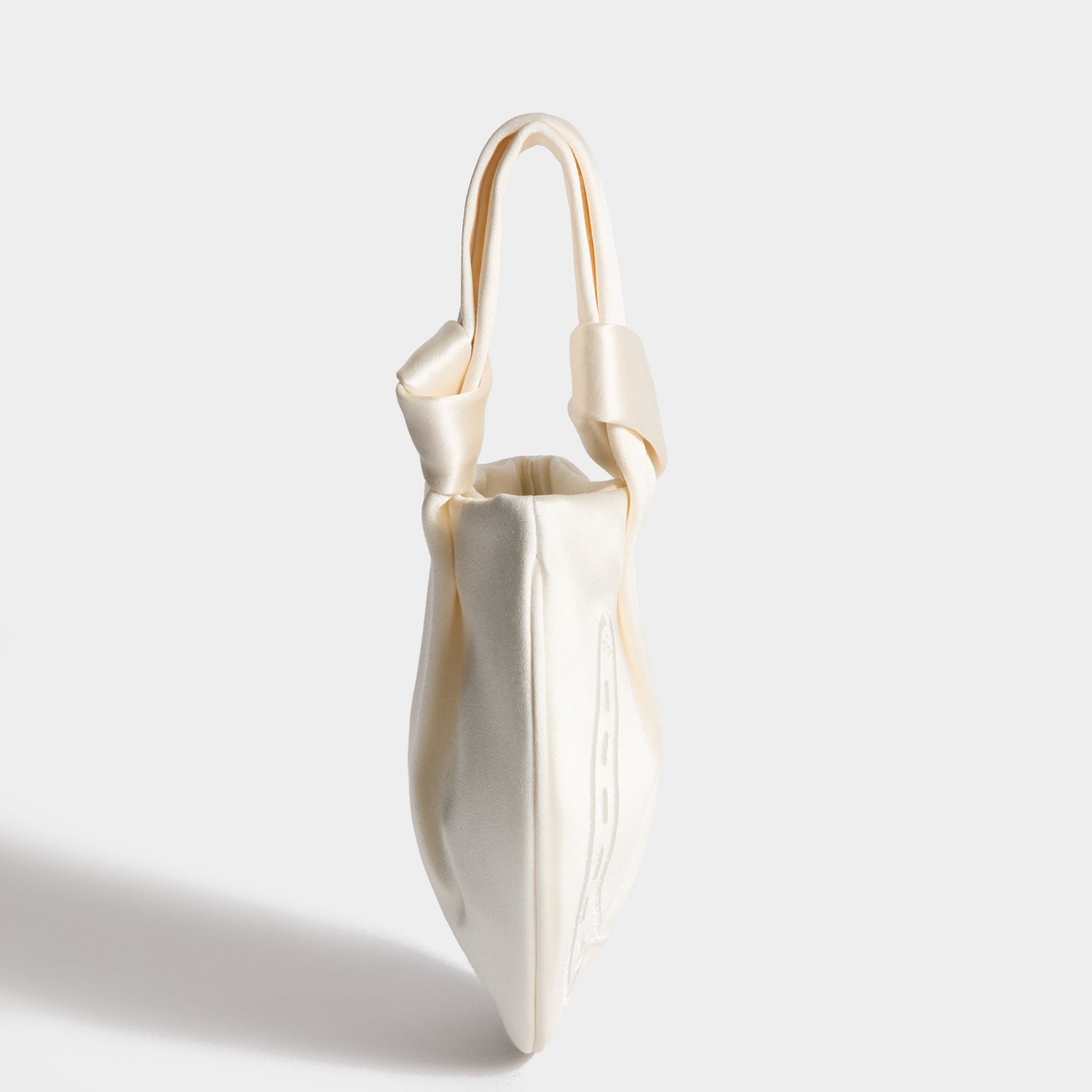 Tie the Knot Clutch -

          
            Double Satin in Ivory -
          

          Anya Hindmarch US
