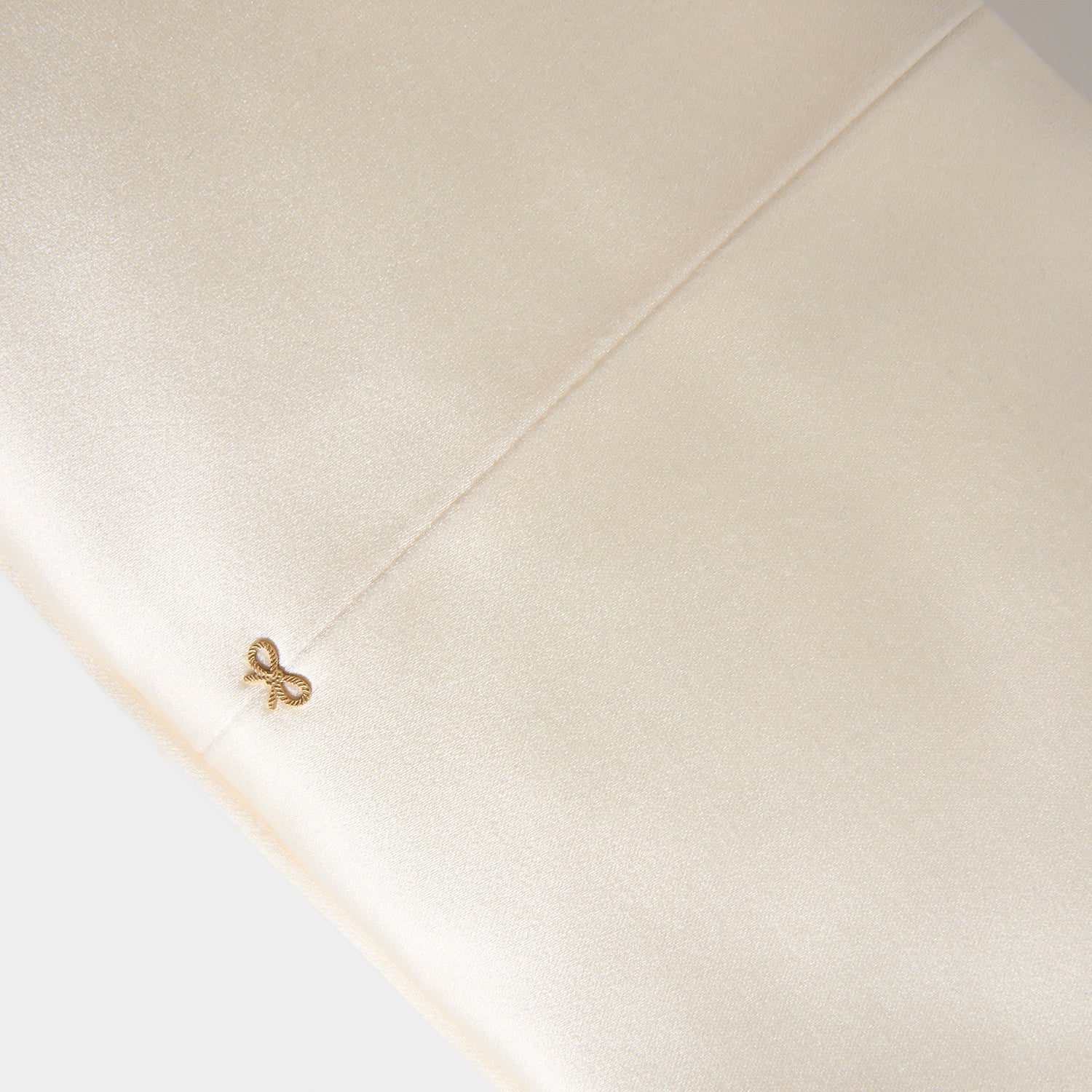 Bow Clutch Bag in Ivory Satin | Anya Hindmarch US