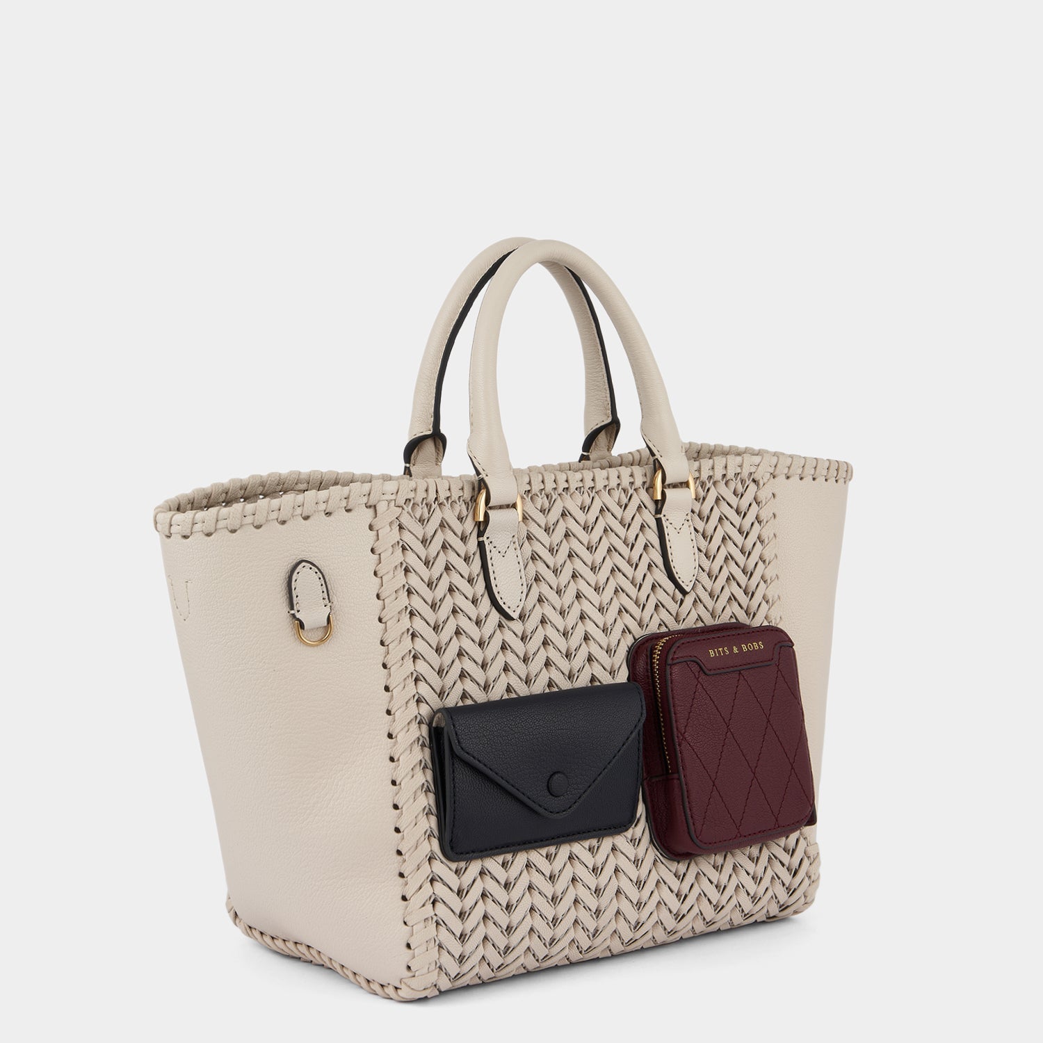 Neeson Multi Pocket Small Square Tote -

                  
                    Capra Leather in Chalk -
                  

                  Anya Hindmarch US
