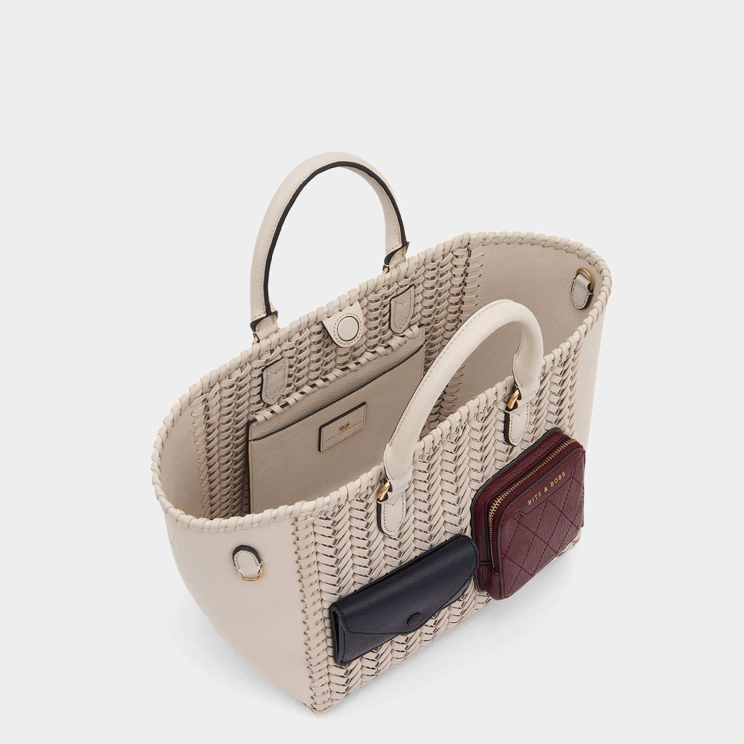 Neeson Multi Pocket Small Square Tote -

                  
                    Capra Leather in Chalk -
                  

                  Anya Hindmarch US
