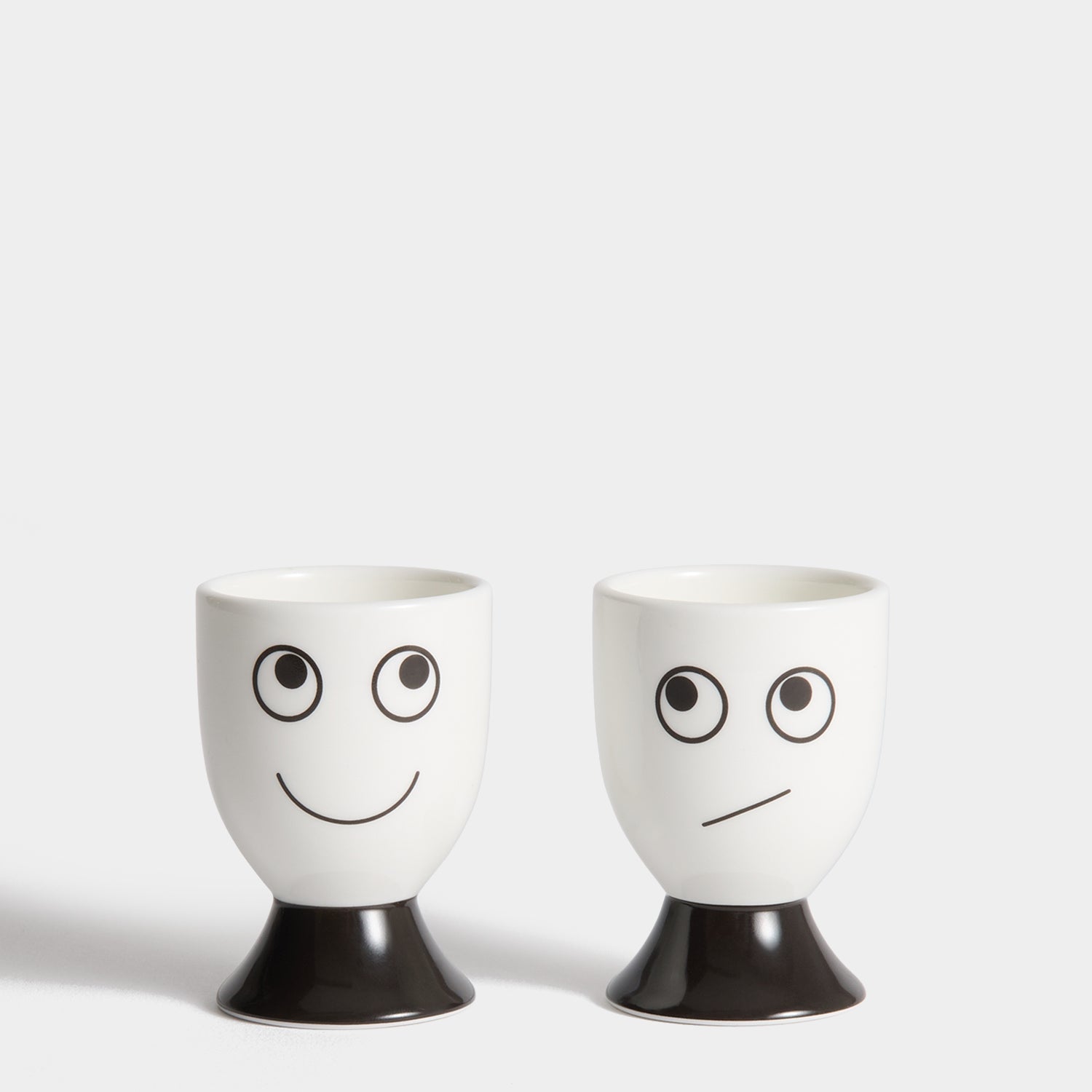 Eyes Egg Cup Set -

          
            Bone China in White -
          

          Anya Hindmarch US
