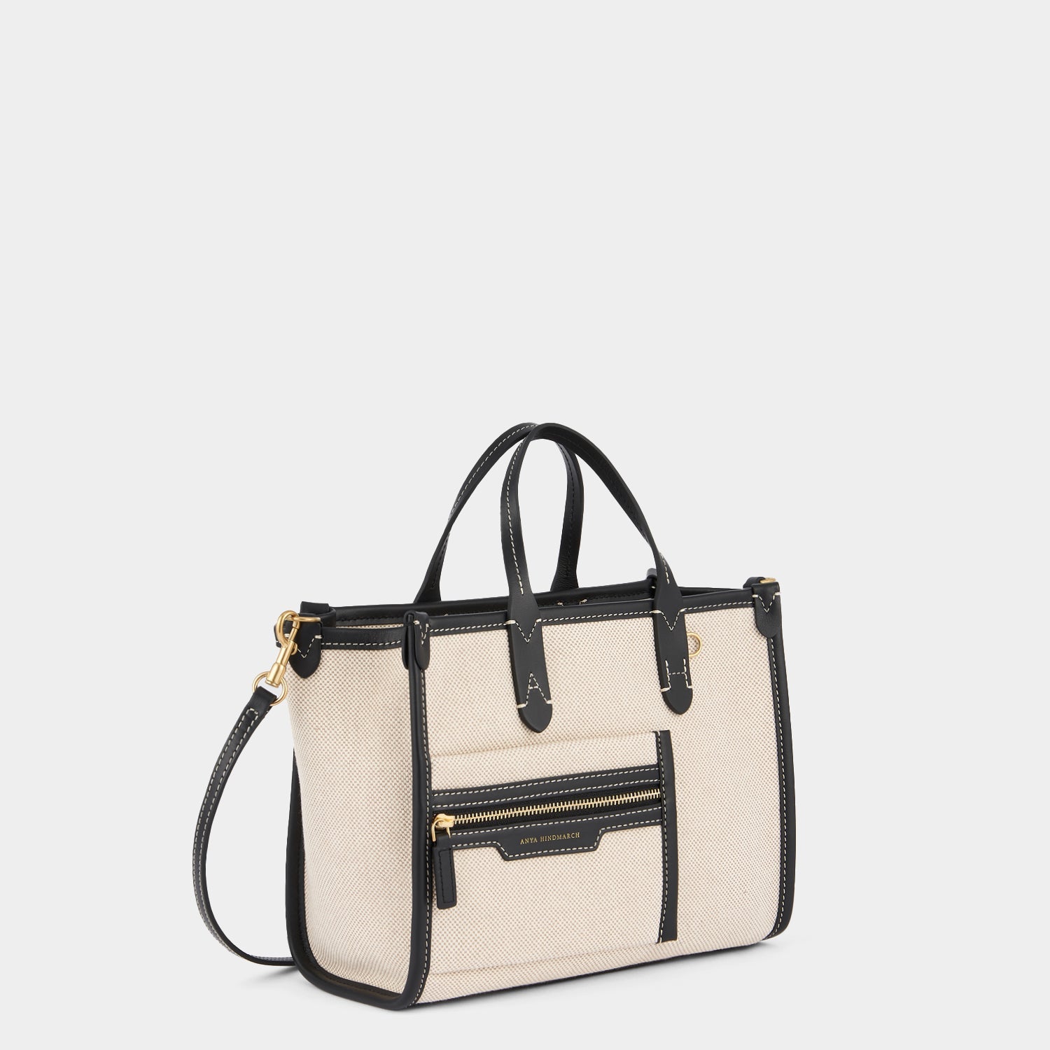 Pocket XS Cross-body Tote -

          
            Mixed Canvas in Natural -
          

          Anya Hindmarch US
