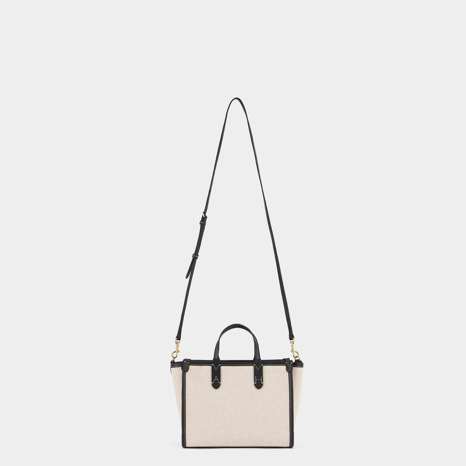 Pocket XS Cross-body Tote -

          
            Mixed Canvas in Natural -
          

          Anya Hindmarch US
