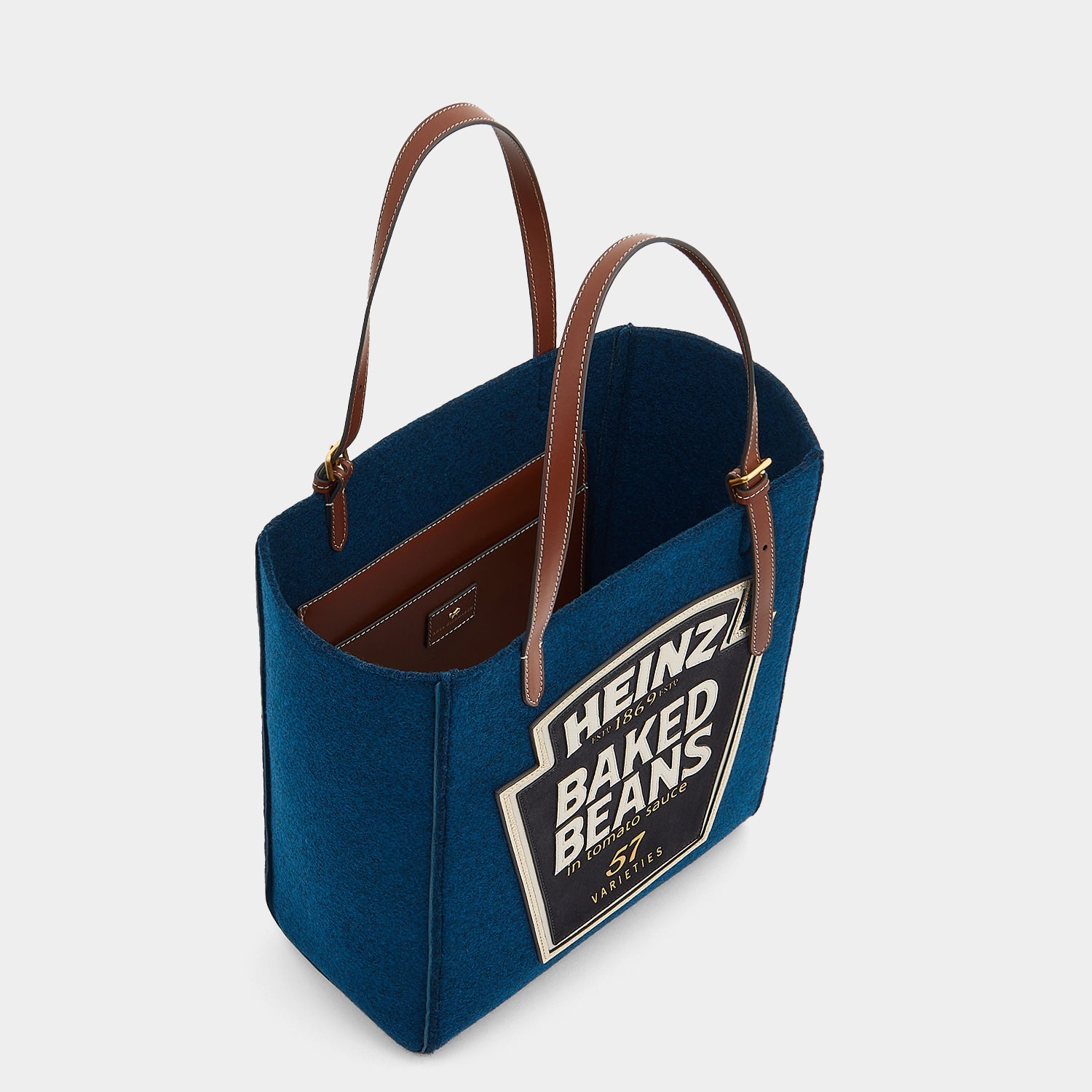 Anya Brands Baked Beans Small Tote -

                  
                    Recycled Felt in Teal -
                  

                  Anya Hindmarch US
