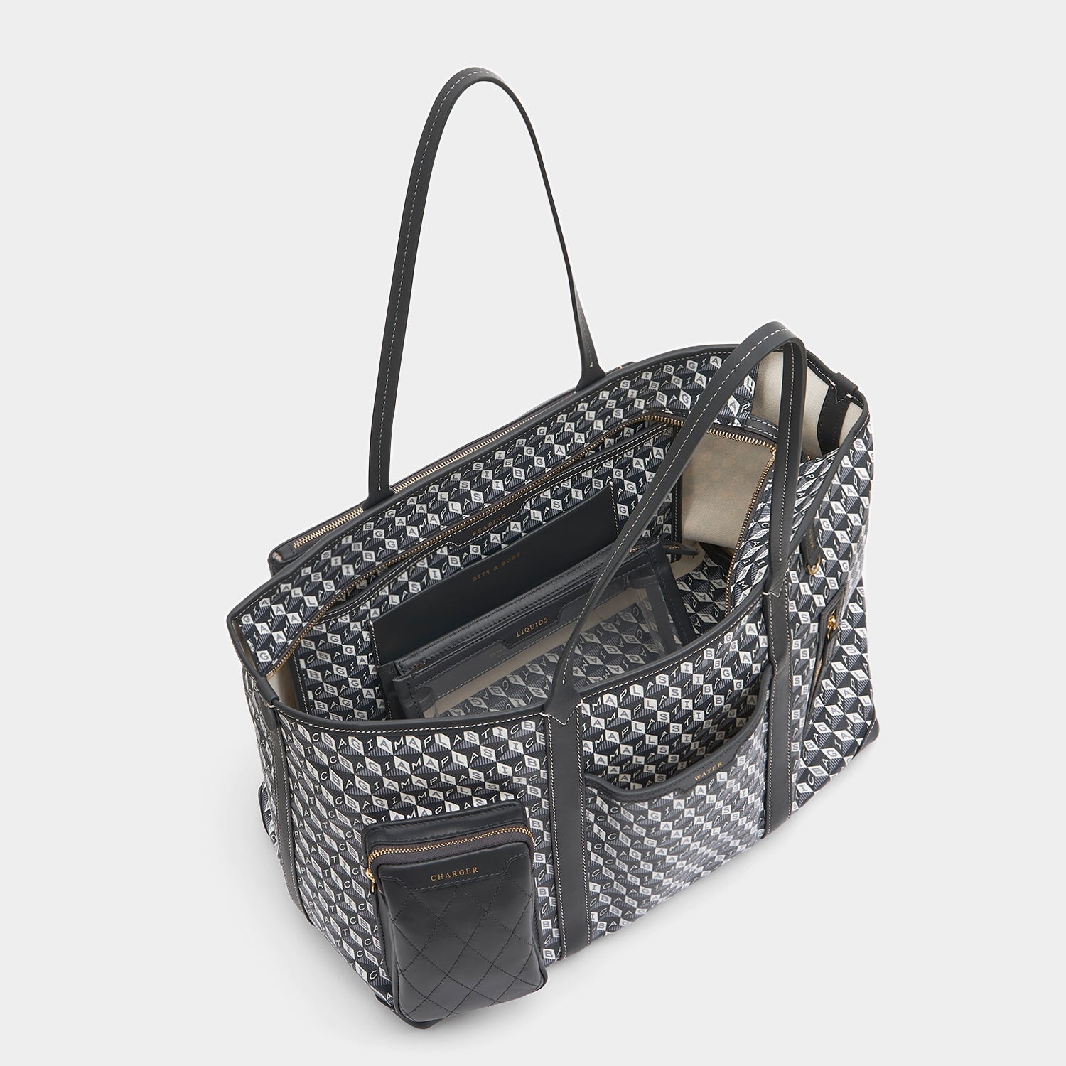 I am a Plastic Bag In-Flight Tote -

                  
                    Recycled Canvas in Charcoal -
                  

                  Anya Hindmarch US
