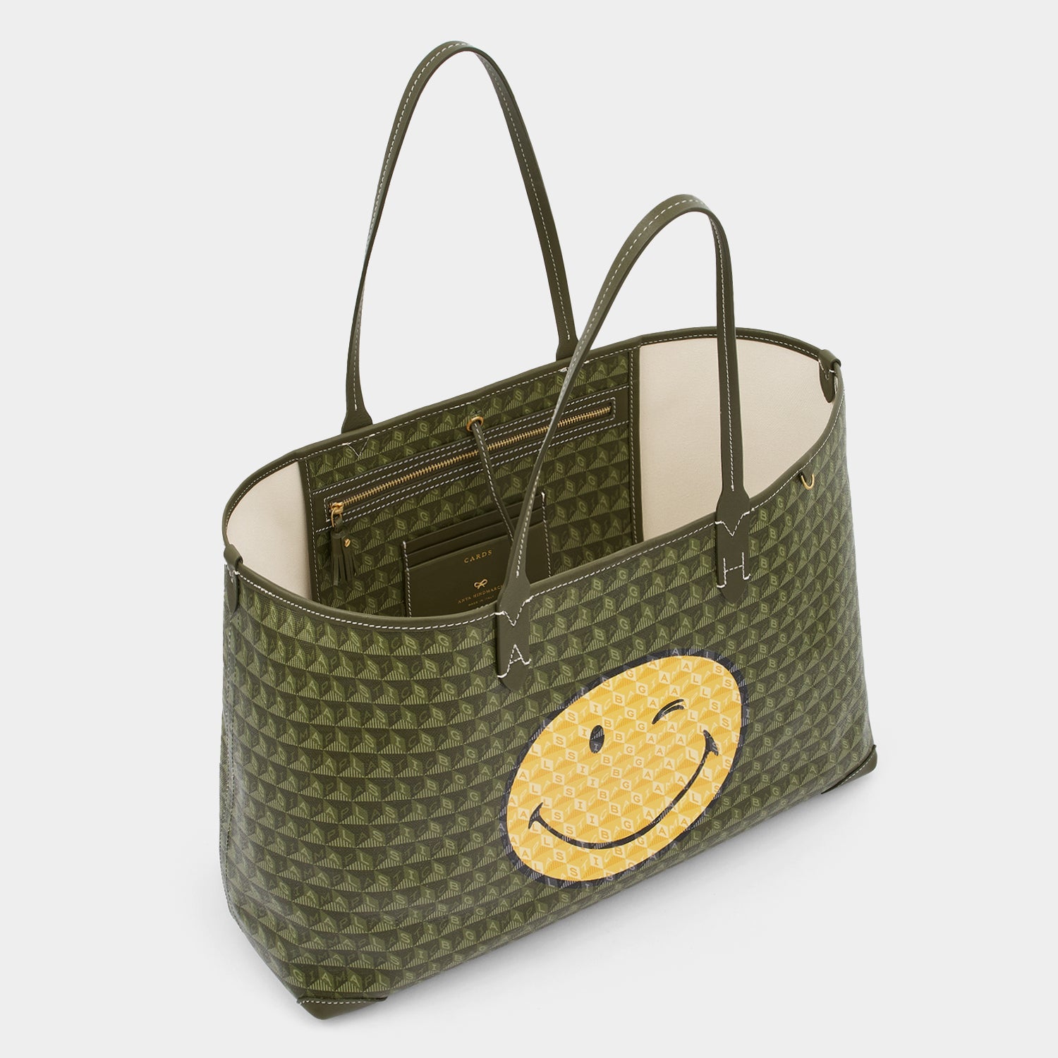 I Am A Plastic Bag Wink Tote -

                  
                    Recycled Canvas in Fern -
                  

                  Anya Hindmarch US
