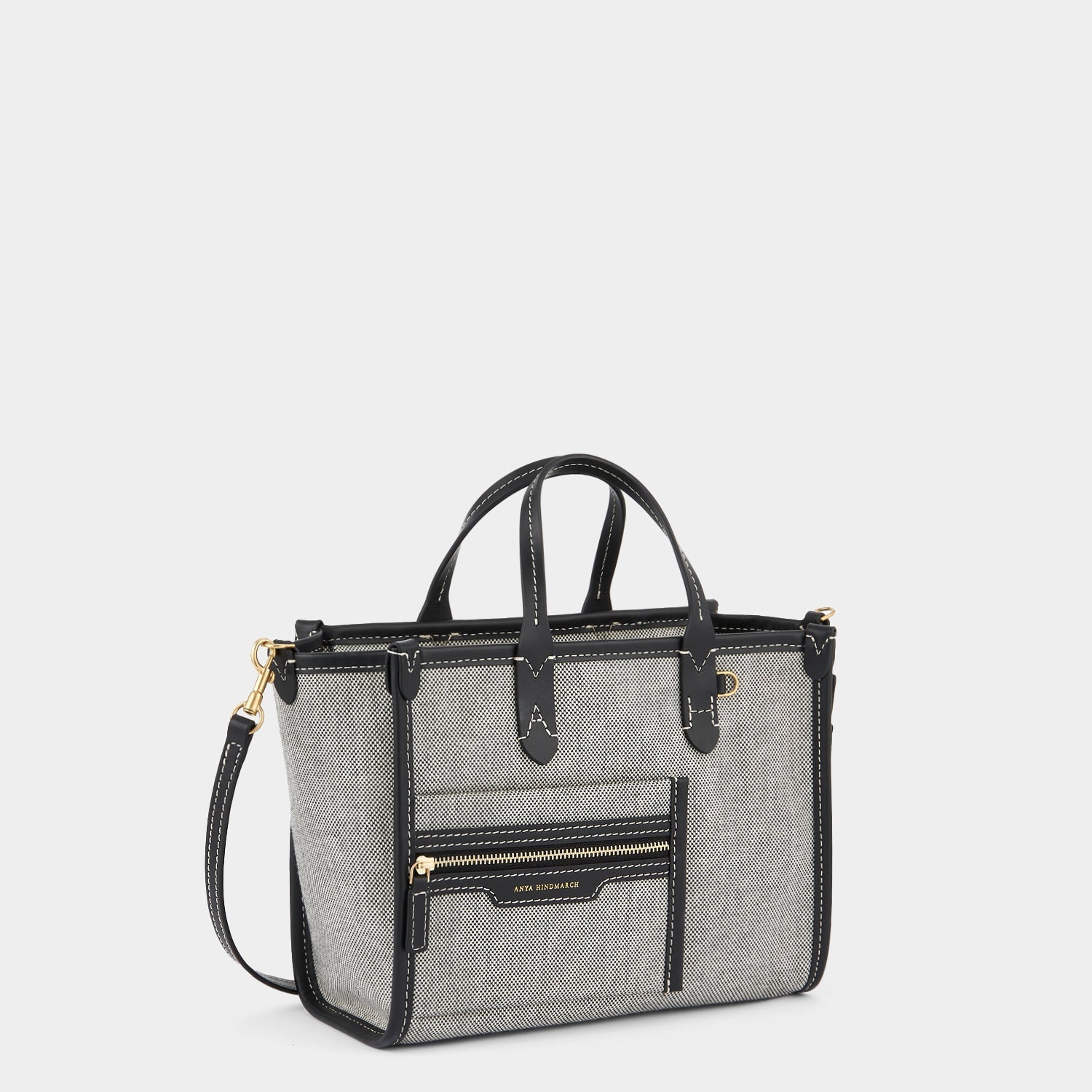 Pocket XS Tote -

                  
                    Mixed Canvas in Salt and Pepper -
                  

                  Anya Hindmarch US
