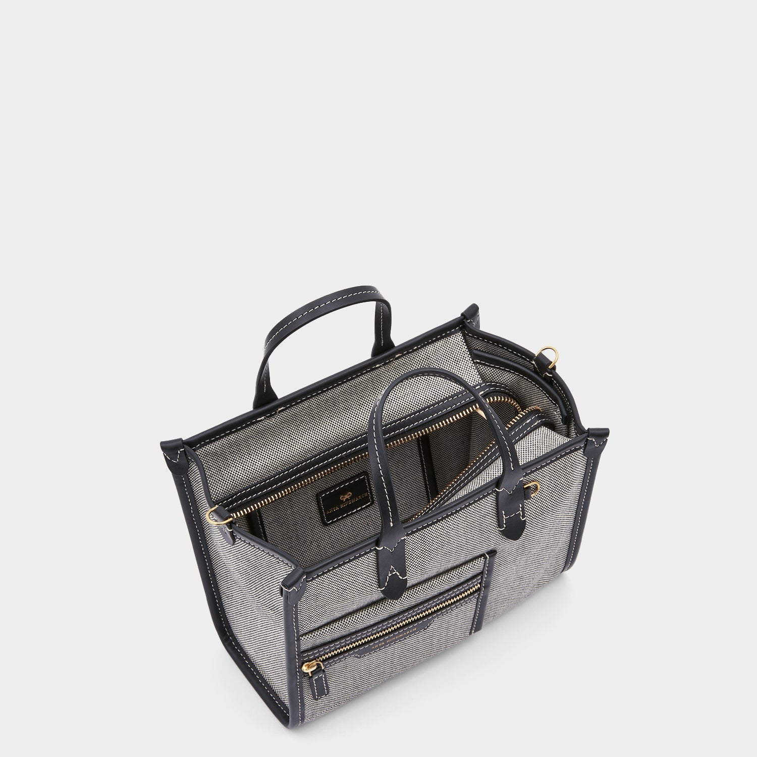 Pocket XS Tote -

                  
                    Mixed Canvas in Salt and Pepper -
                  

                  Anya Hindmarch US
