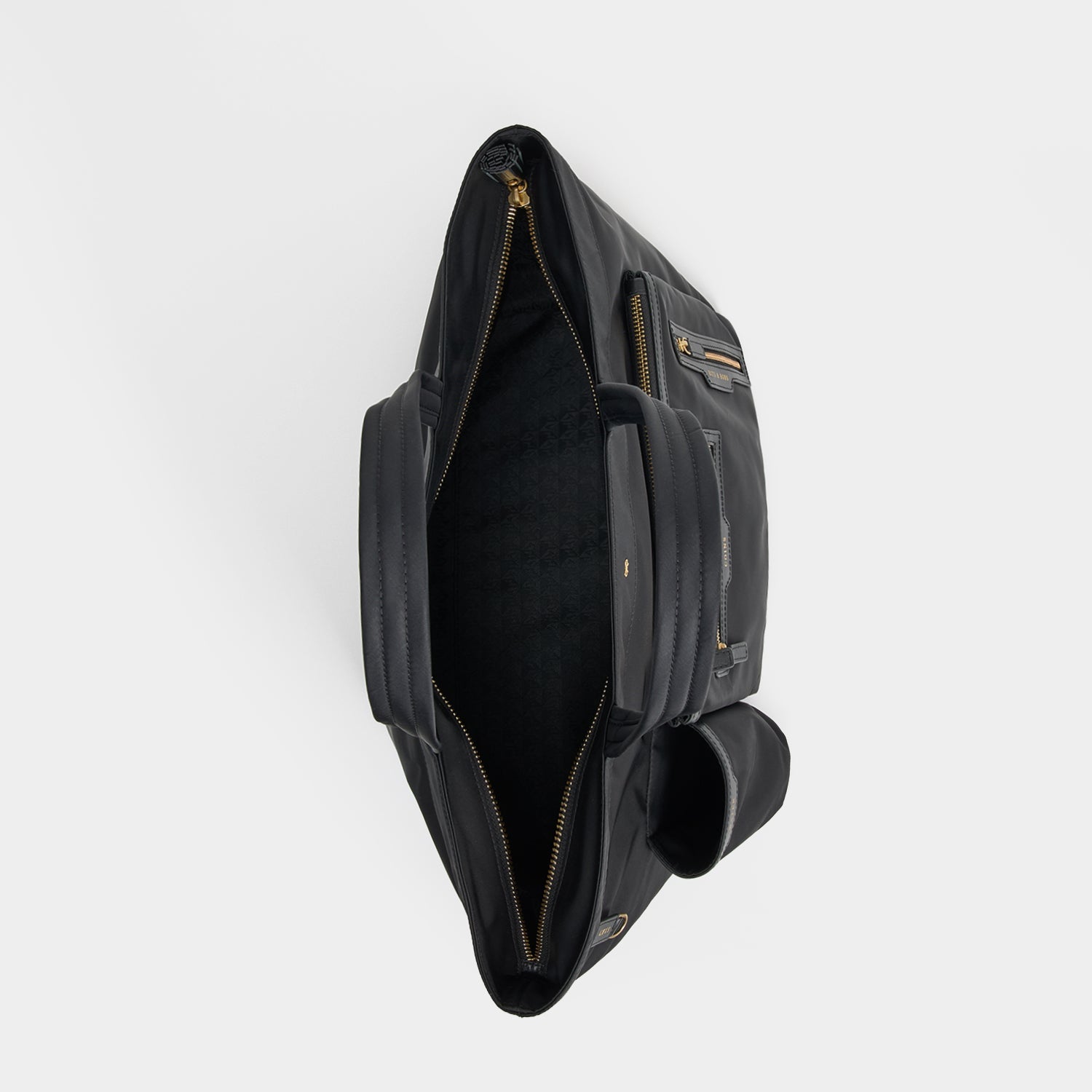 E/W Multi Pocket Tote -

          
            Regenerated ECONYL® in Black -
          

          Anya Hindmarch US
