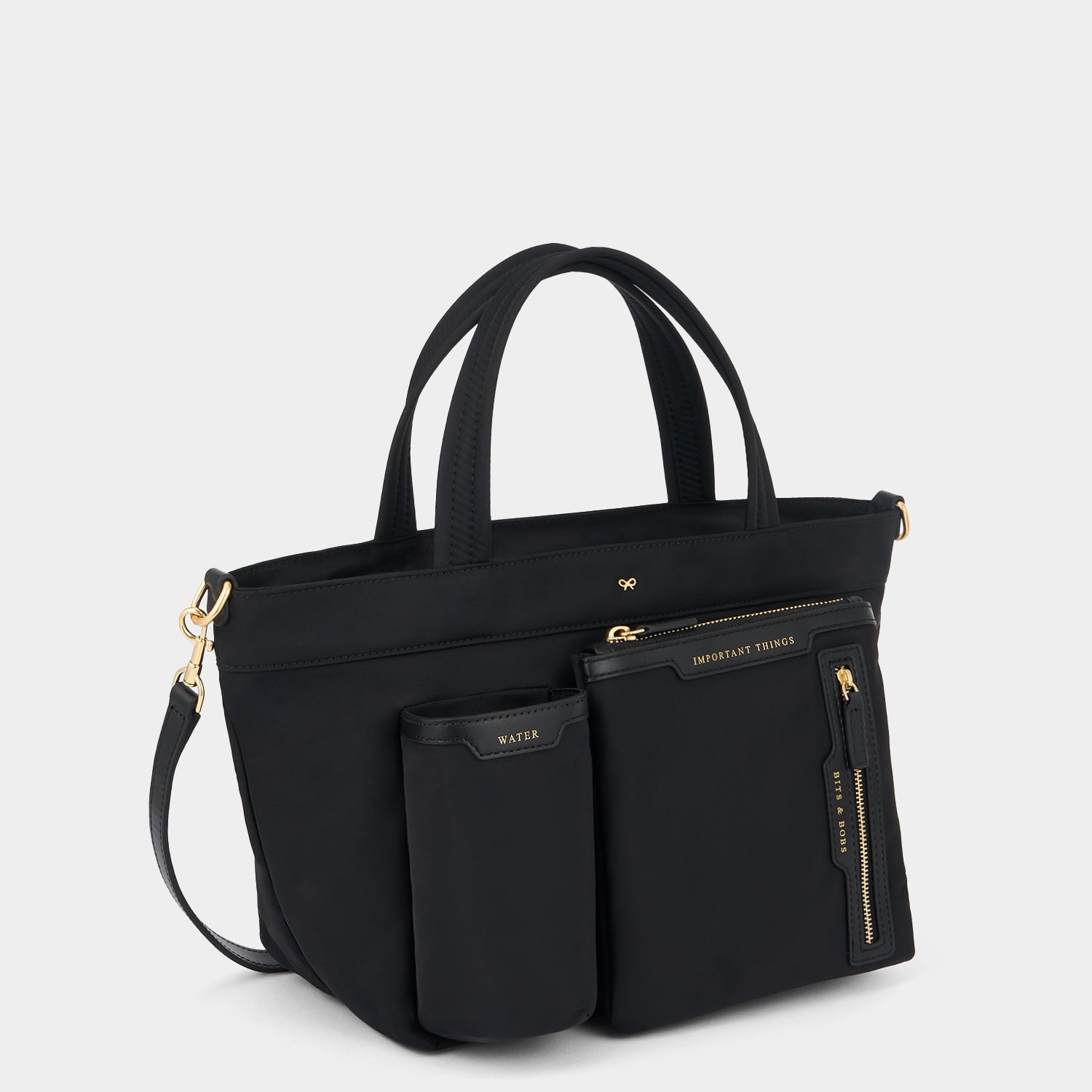 E/W Multi Pocket Mini Cross-body Tote -

          
            Regenerated ECONYL® in Black -
          

          Anya Hindmarch US
