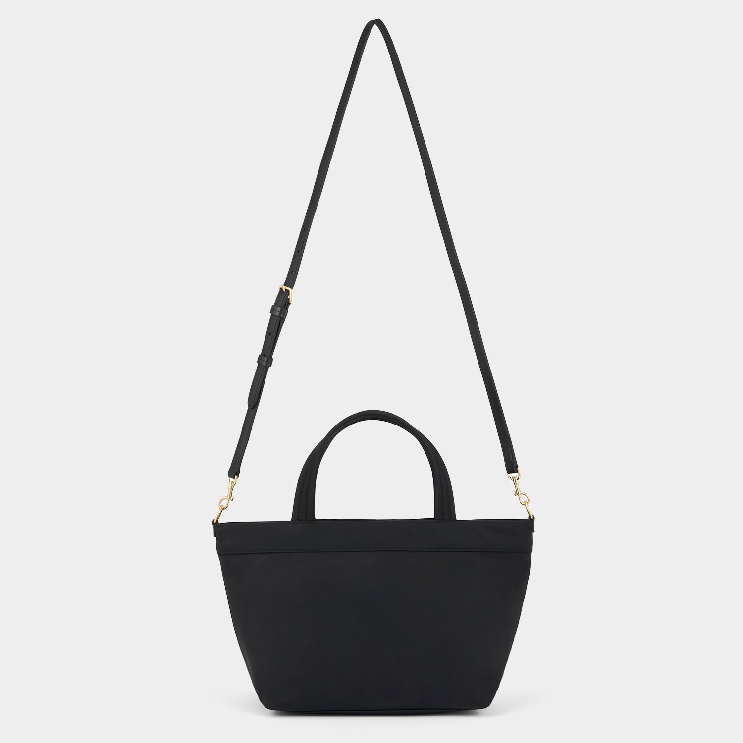 E/W Multi Pocket Mini Cross-body Tote -

          
            Regenerated ECONYL® in Black -
          

          Anya Hindmarch US
